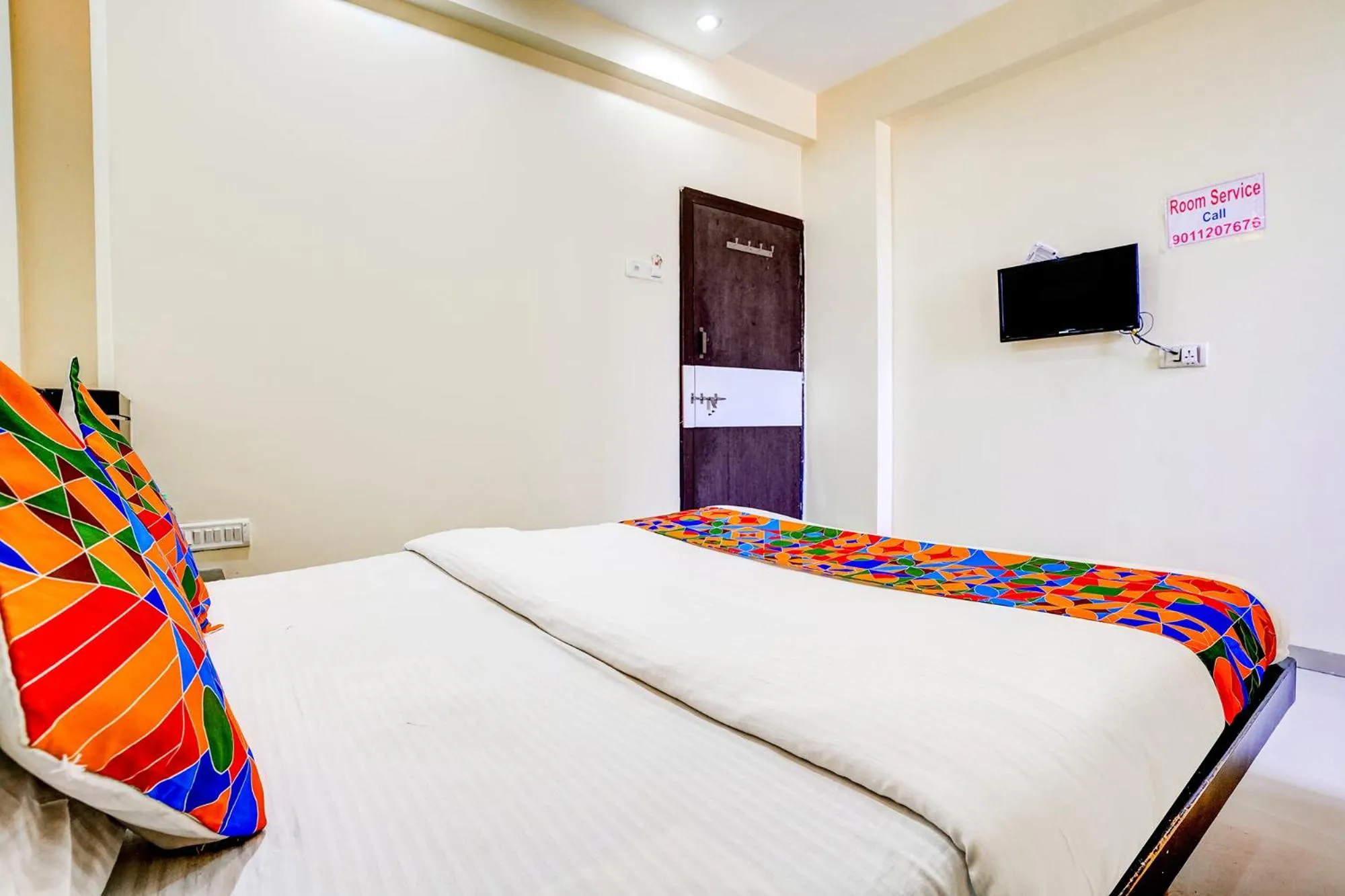 Communal lounge/ TV room, Bed in FabHotel Sai Govind