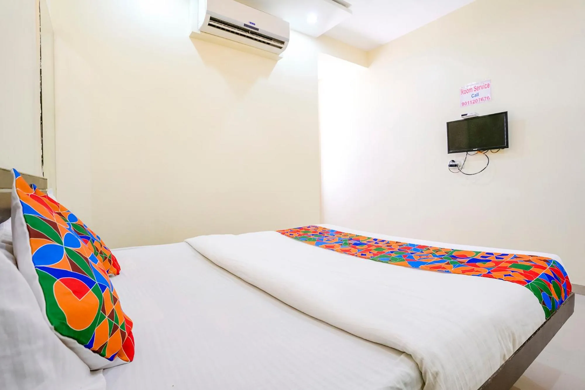 Communal lounge/ TV room, Bed in FabHotel Sai Govind