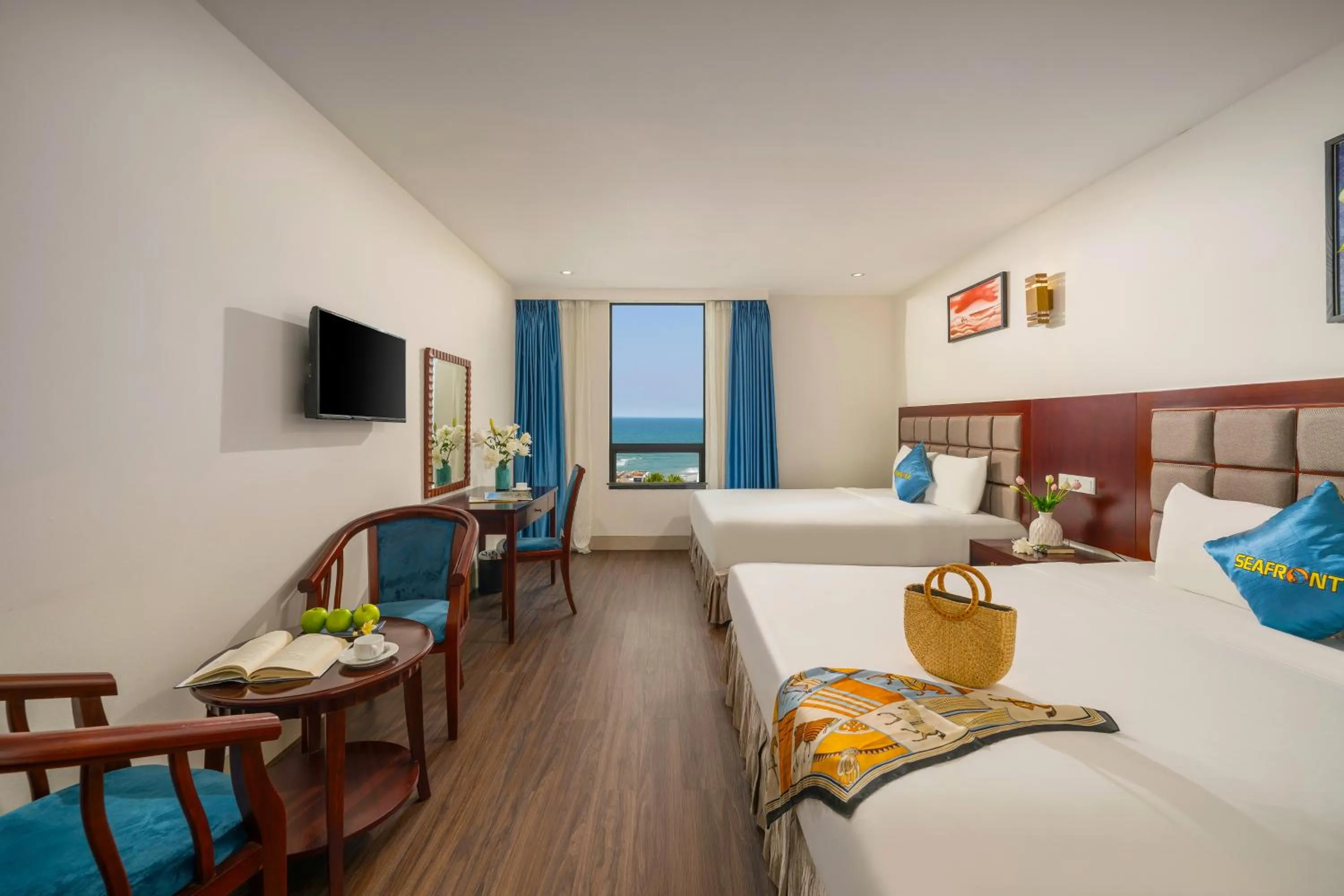 Seating area, Bed in SeaFront Hotel DaNang