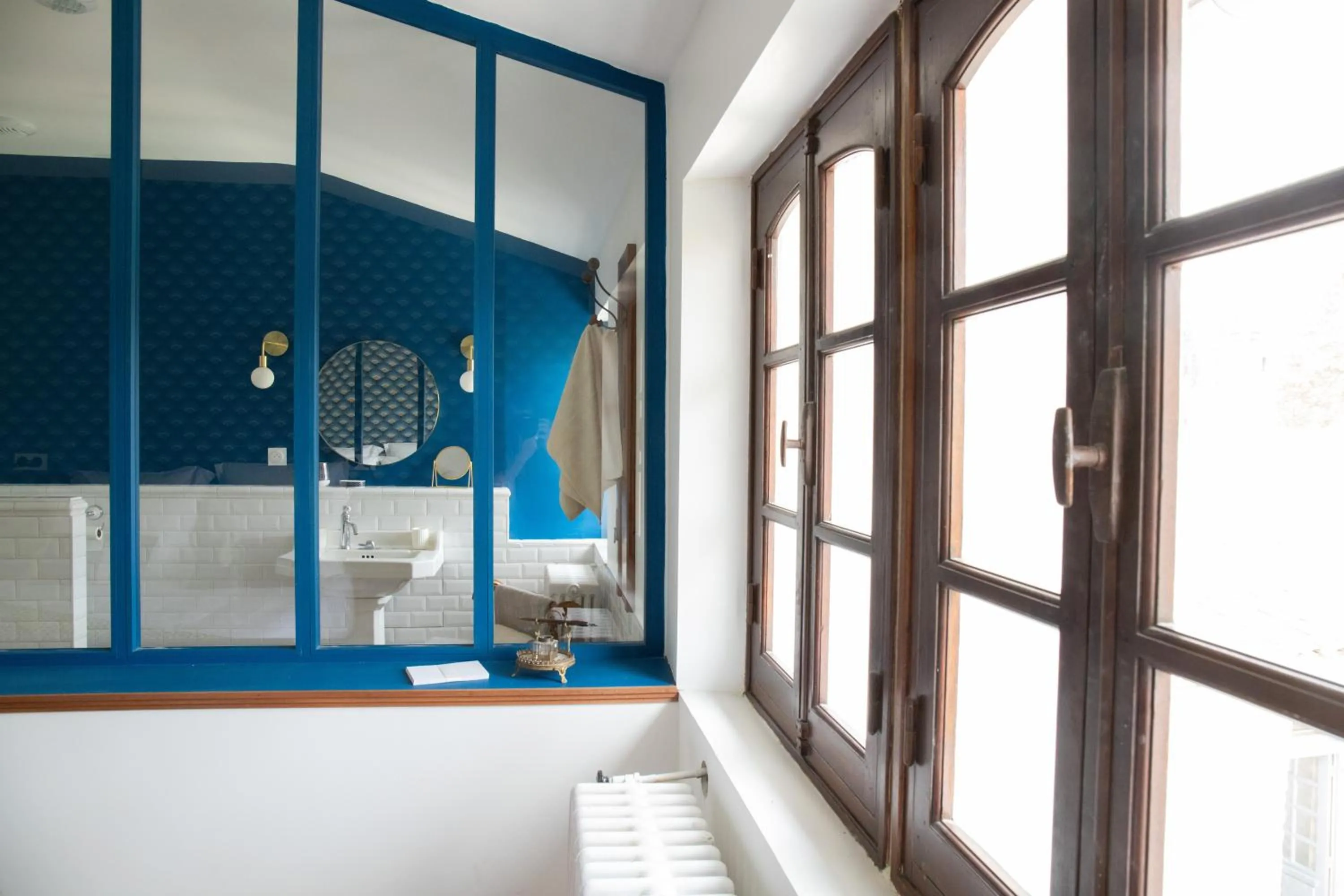 Bathroom in Maison et table d'hôtes Le Camélia Blanc