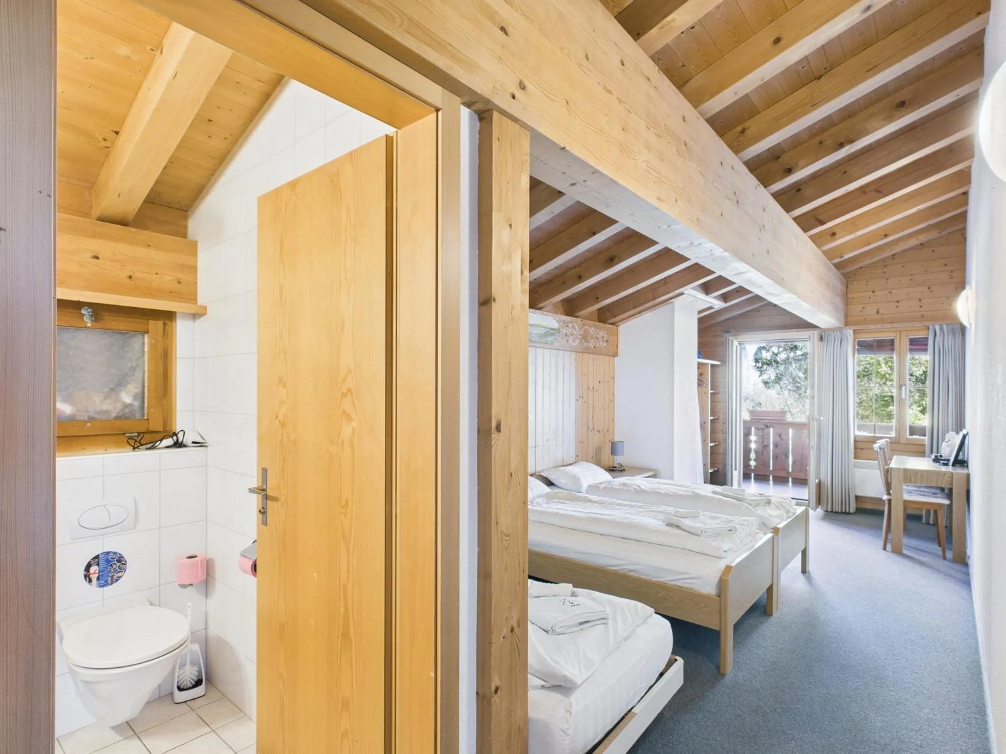 Toilet, Bed in Hotel Wildbach Brienz
