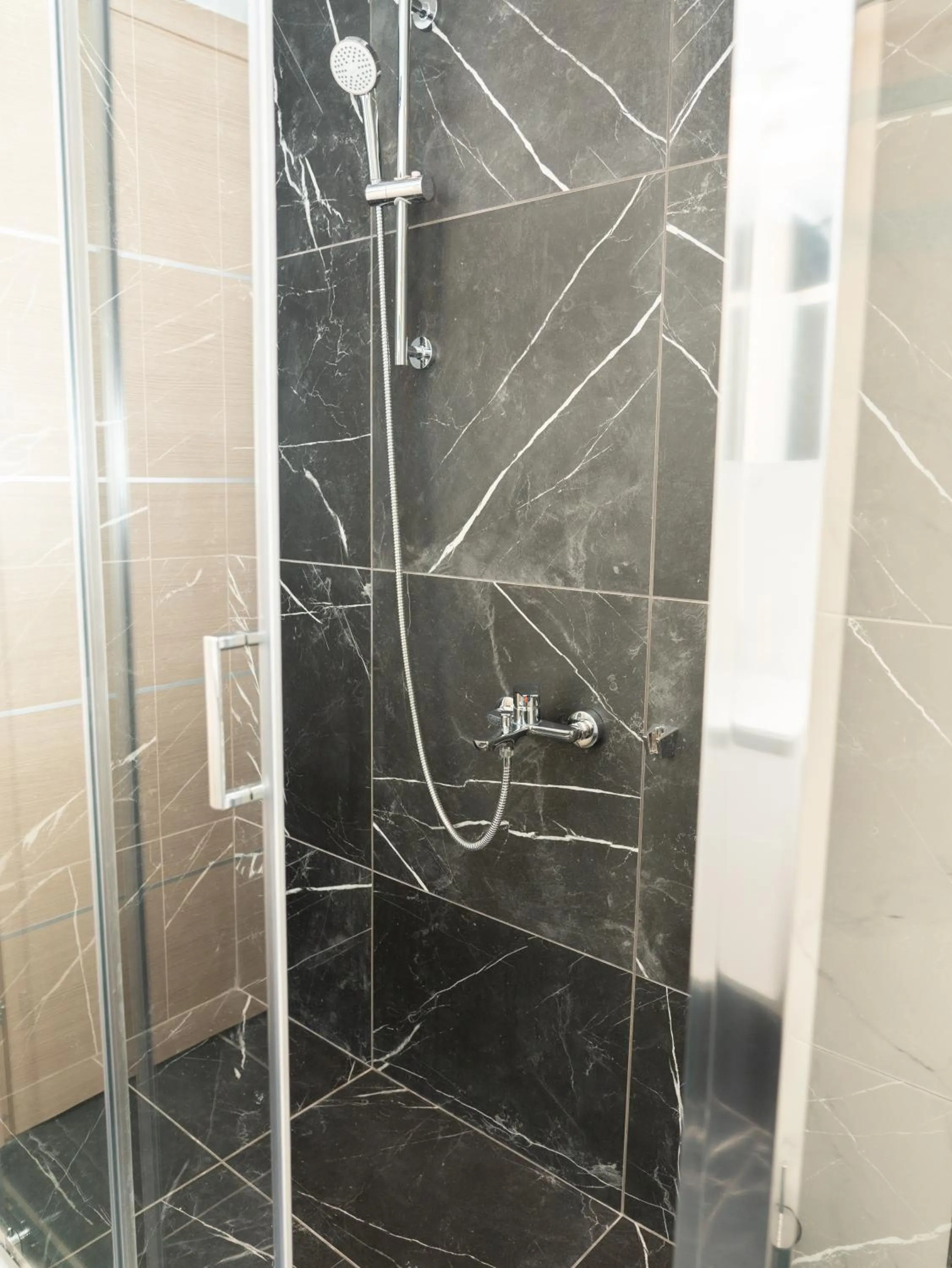 Shower in ALLAGIANNIS GROUP APARTMENTS