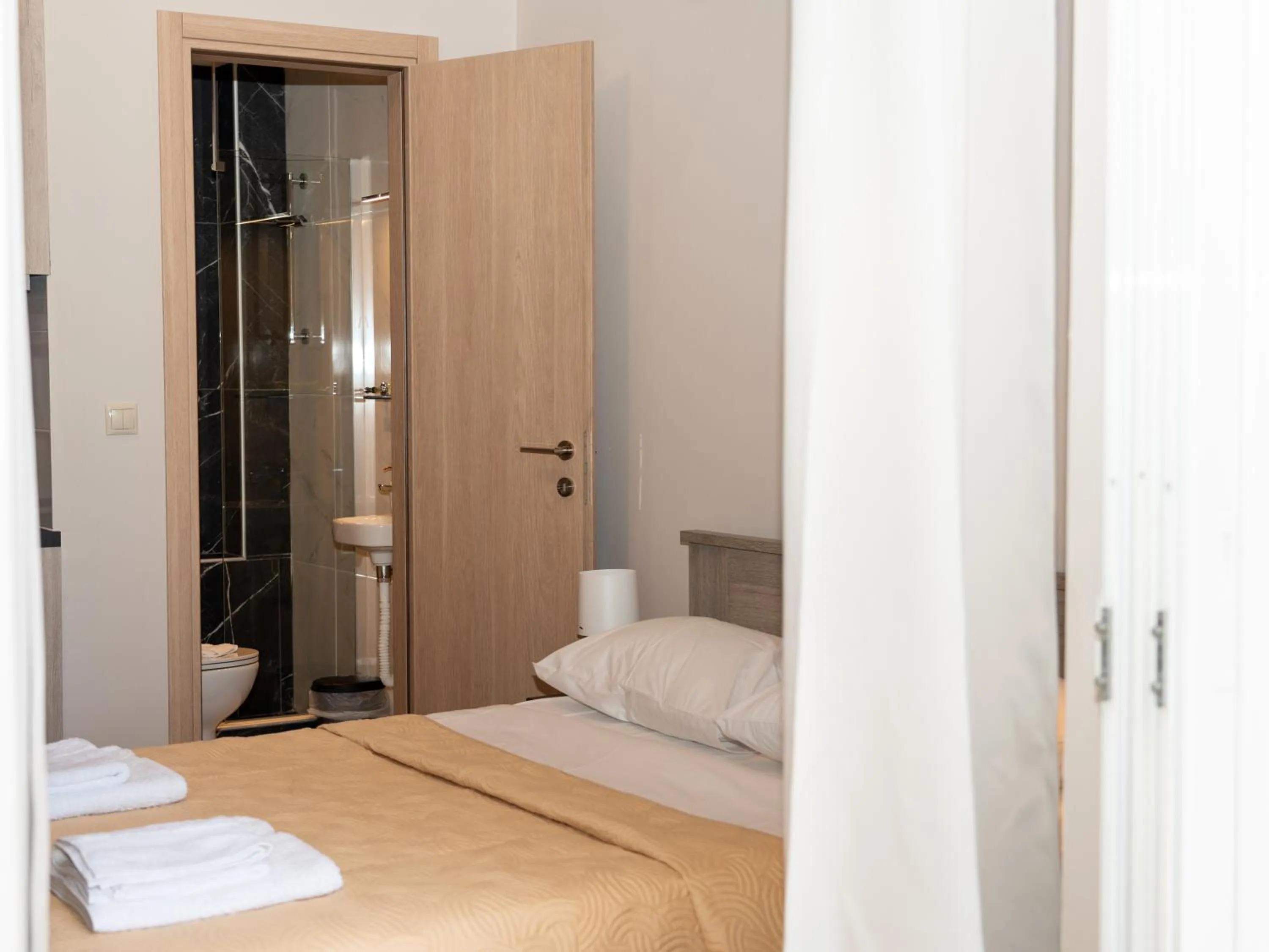 Bathroom, Bed in ALLAGIANNIS GROUP APARTMENTS