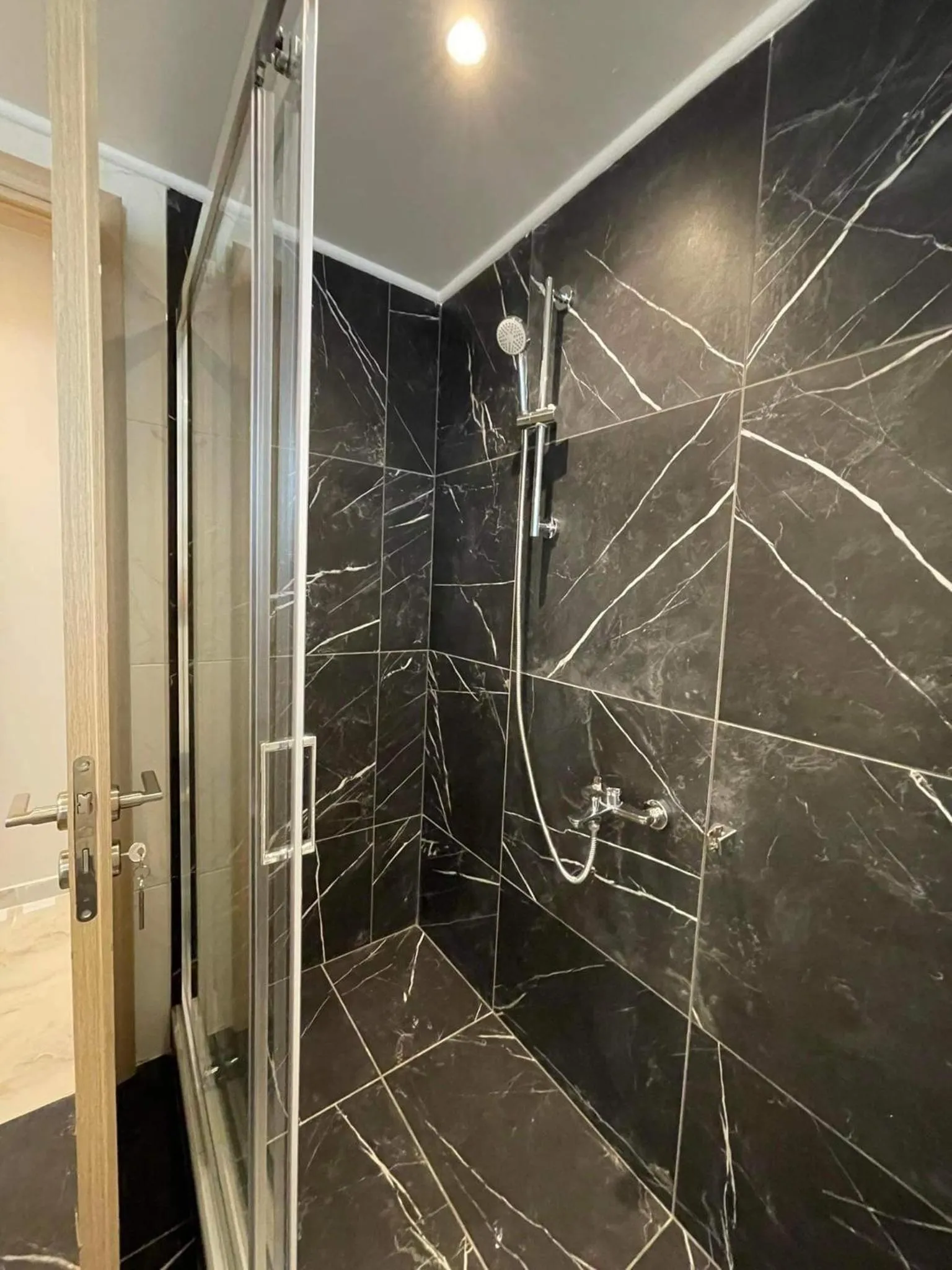 Shower in ALLAGIANNIS GROUP APARTMENTS