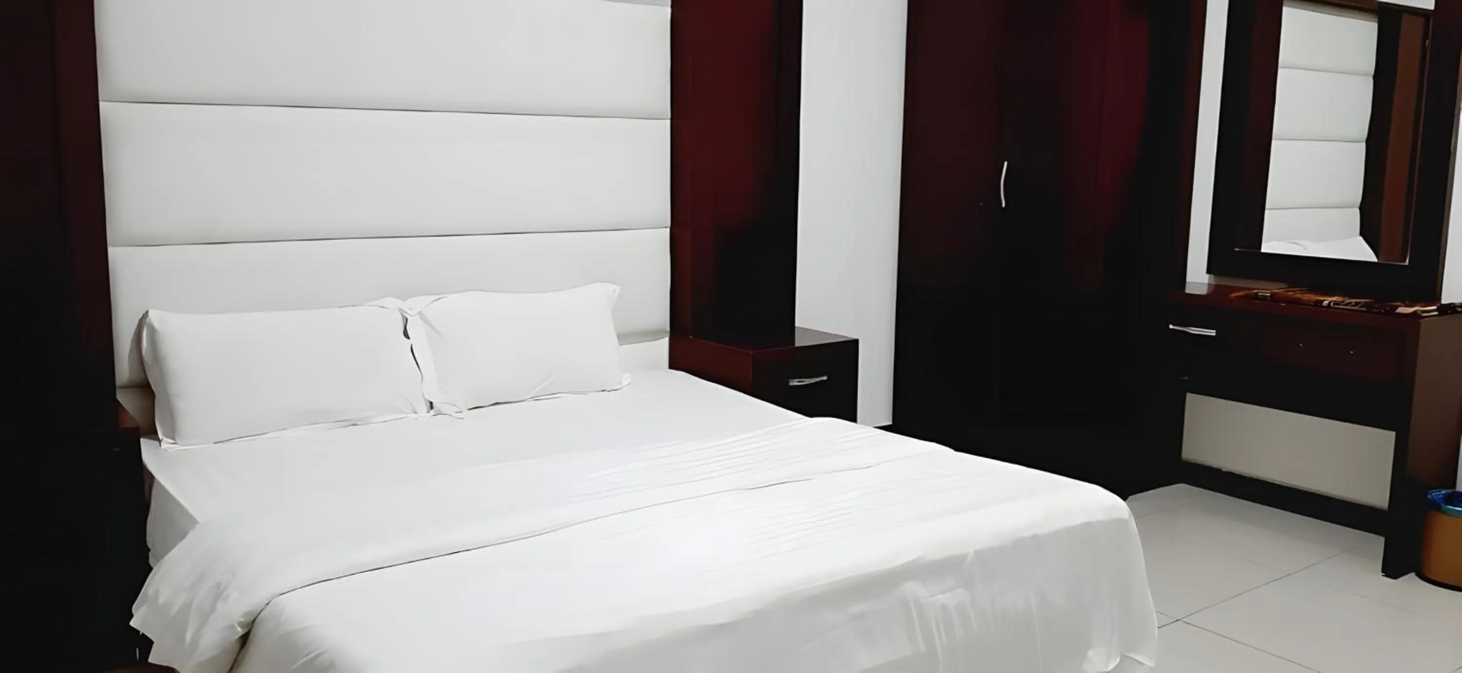 Bed in شقق أهلين ثلاثة للشقق المخدومة