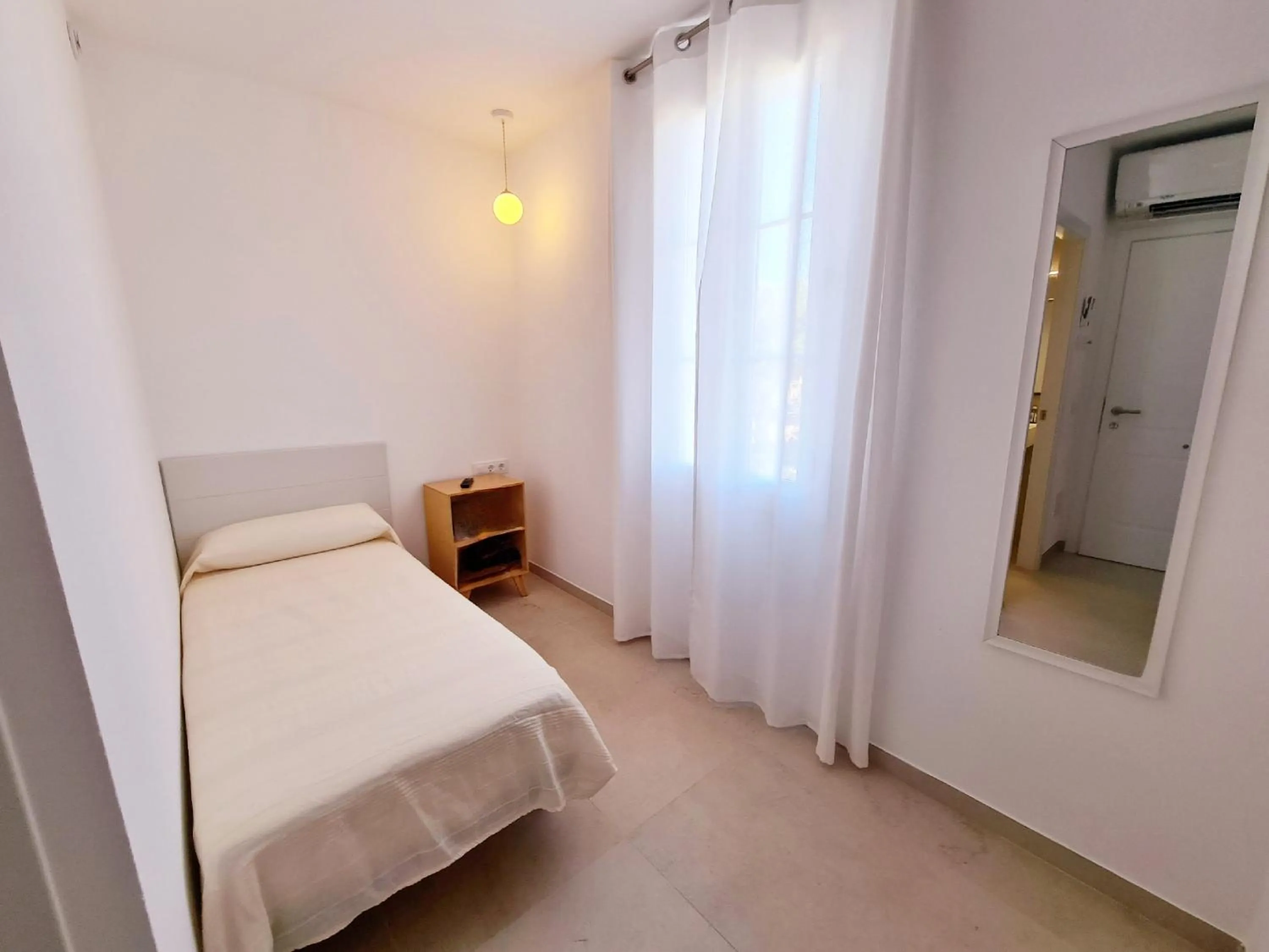 Bed in Waki Conscious Hotel