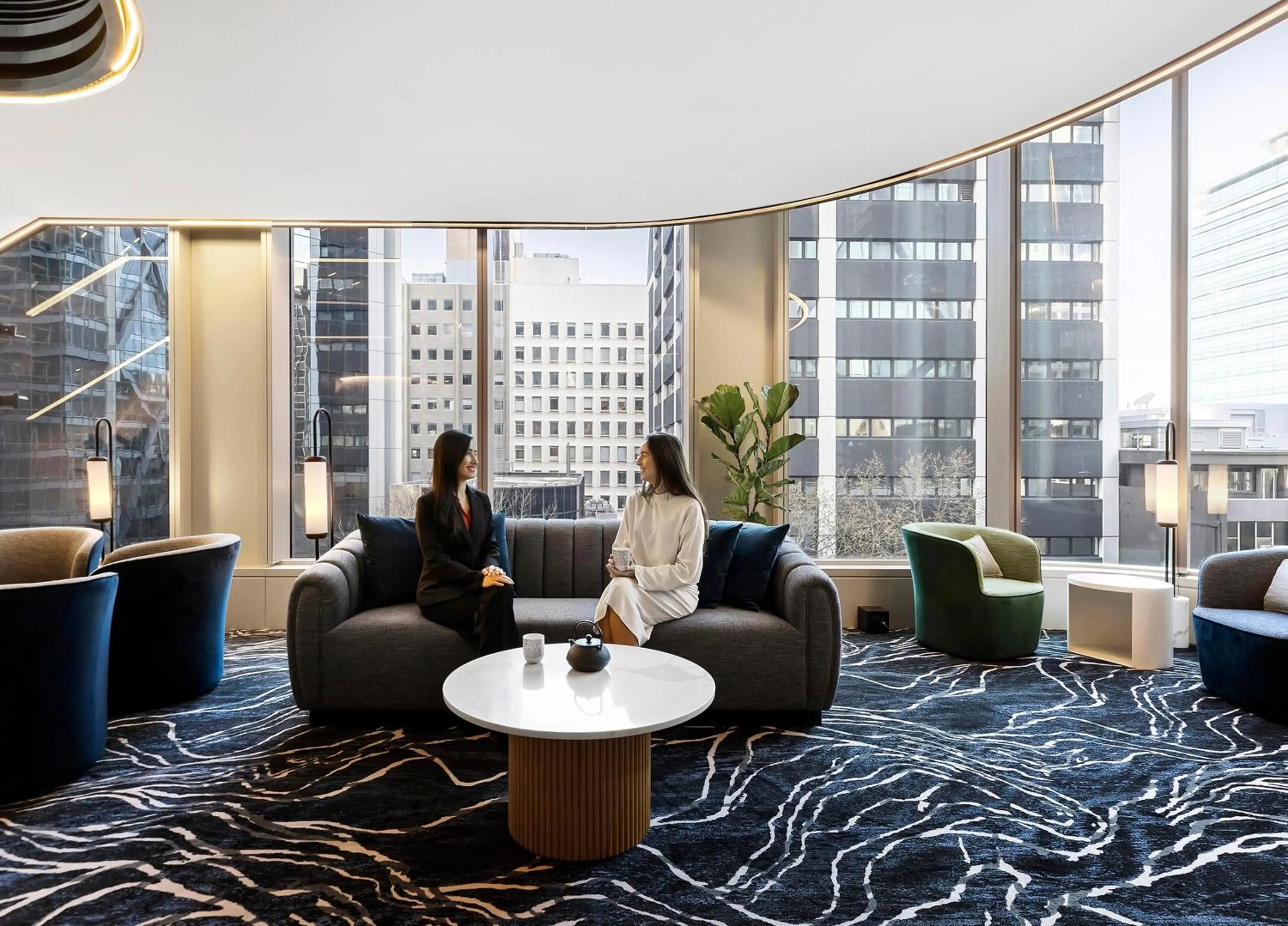 Communal lounge/ TV room in Citadines Walker North Sydney