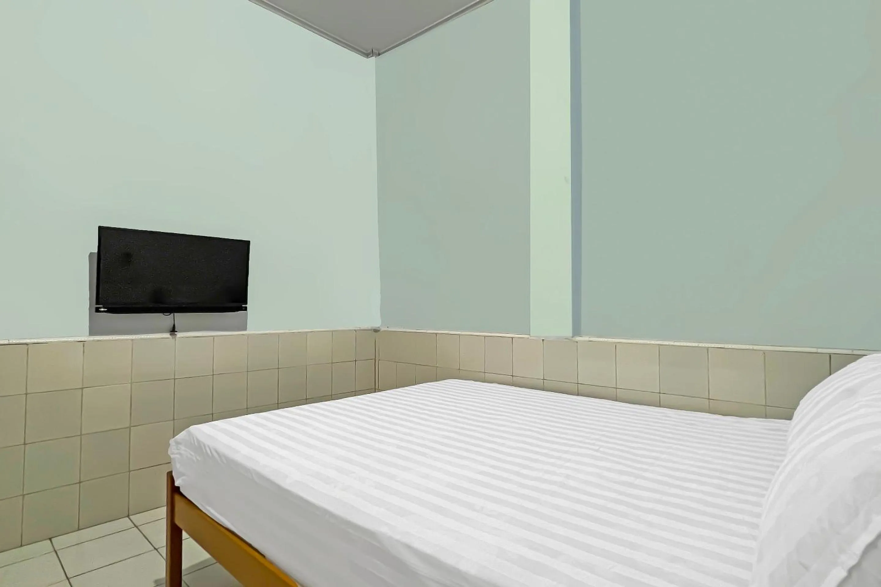 Bedroom, Bed in Hotel O Oma Homestay