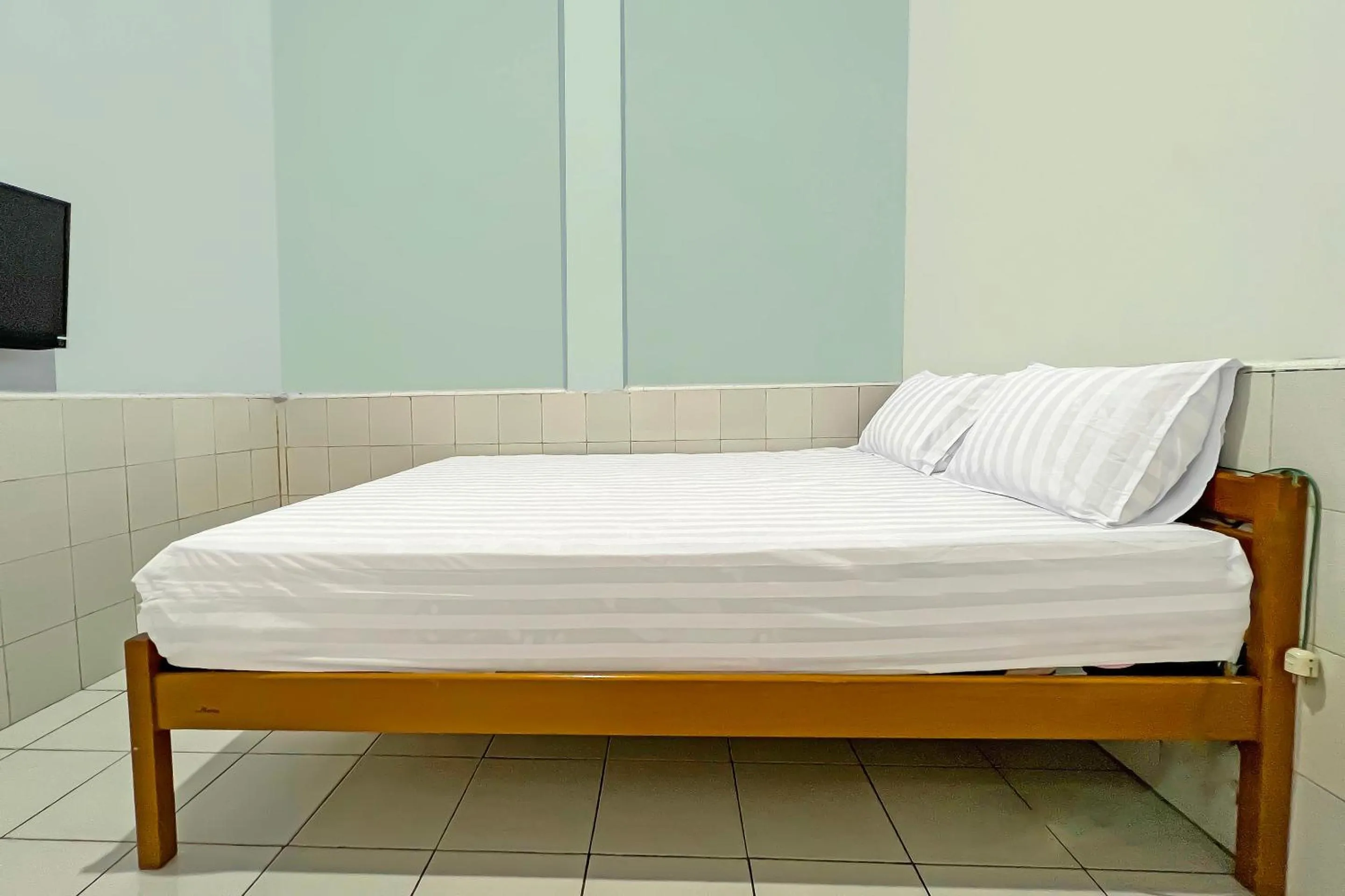 Bedroom, Bed in Hotel O Oma Homestay