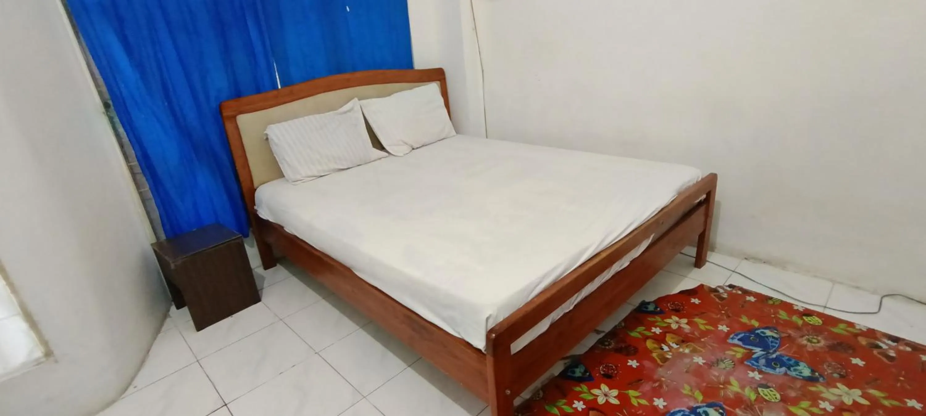 Bedroom, Bed in Hotel O Wisma Parakita Syariah Near RS Faisal Patalasang