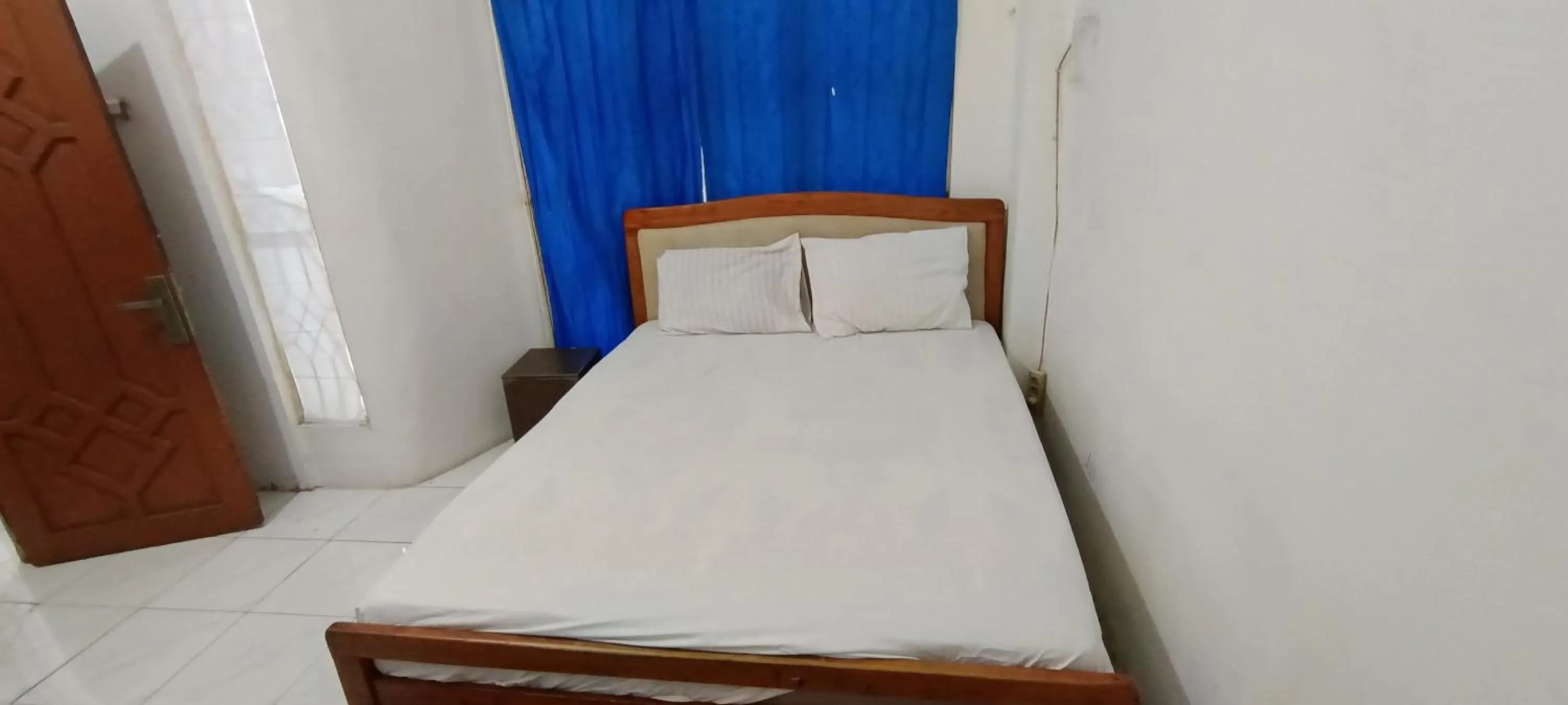 Bedroom, Bed in Hotel O Wisma Parakita Syariah Near RS Faisal Patalasang