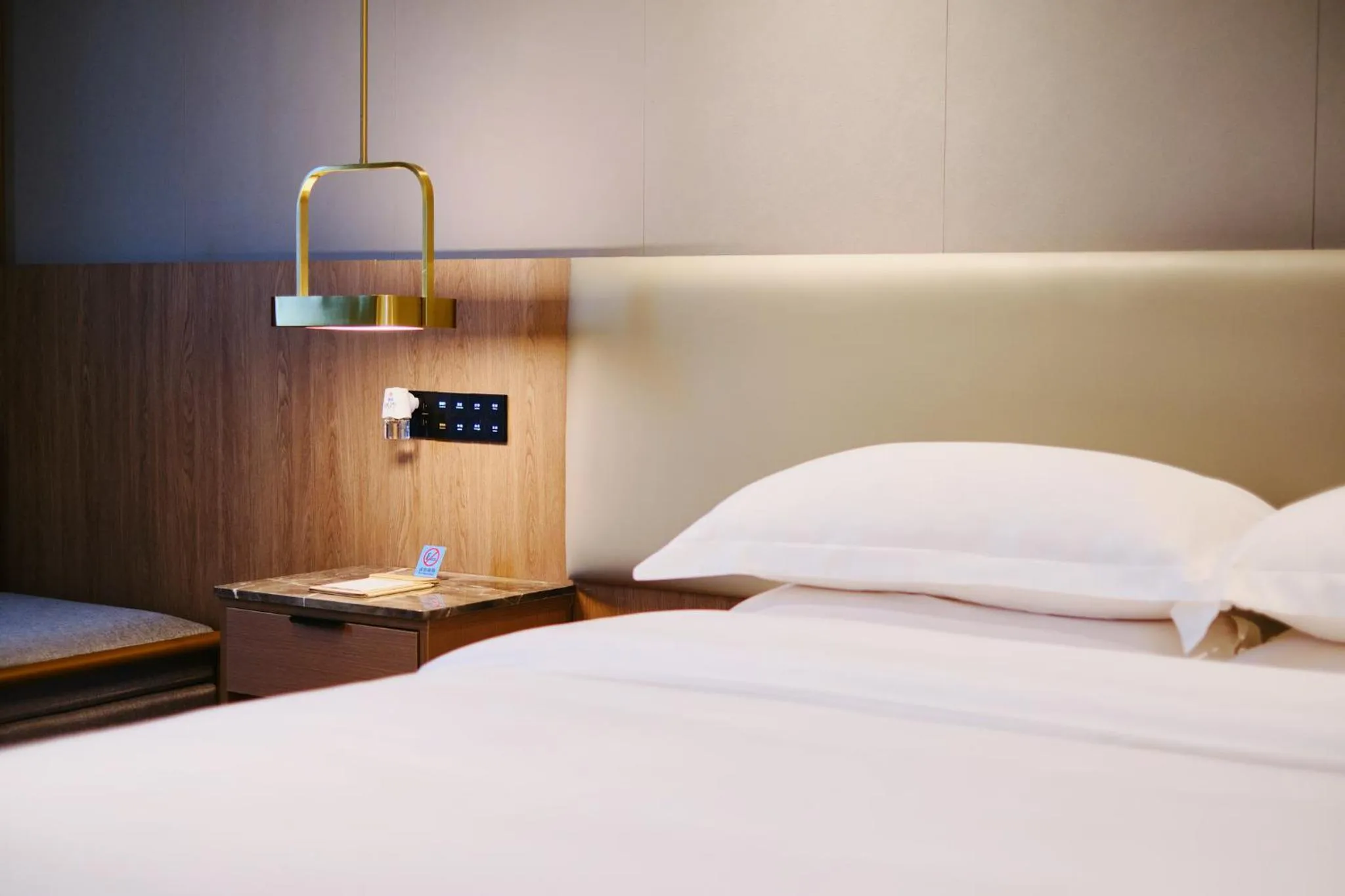 Bed in Harriway Garden Hotel Houjie