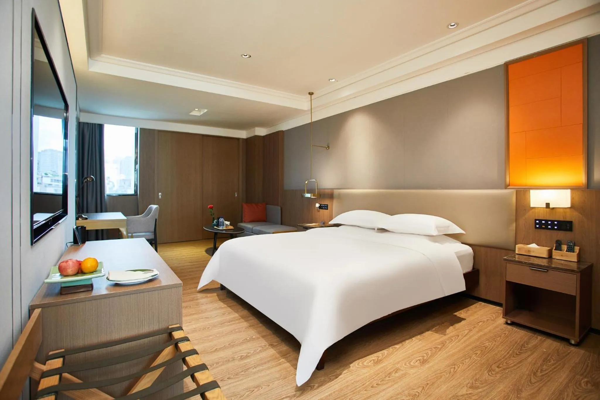 Bed in Harriway Garden Hotel Houjie