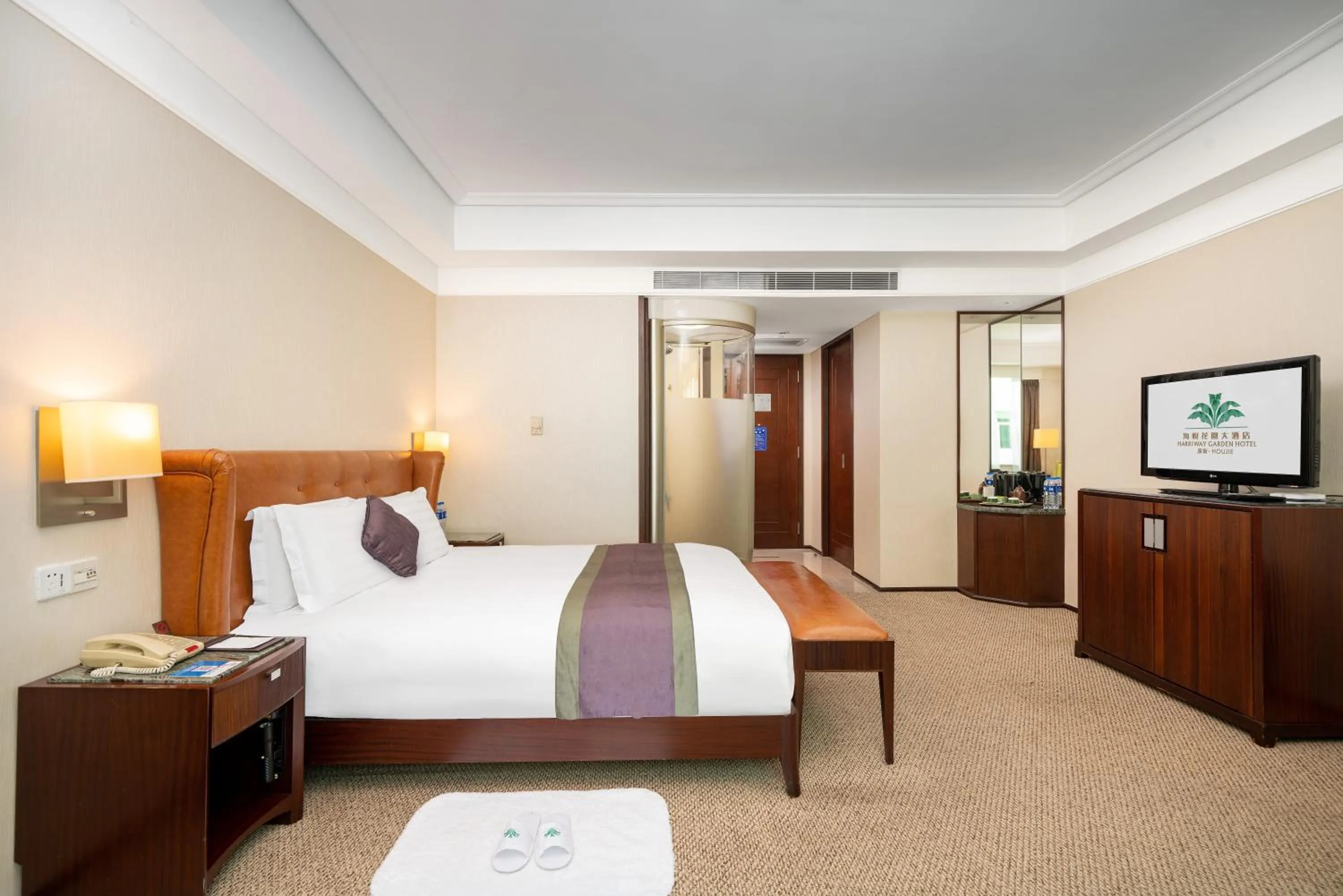 Bed in Harriway Garden Hotel Houjie