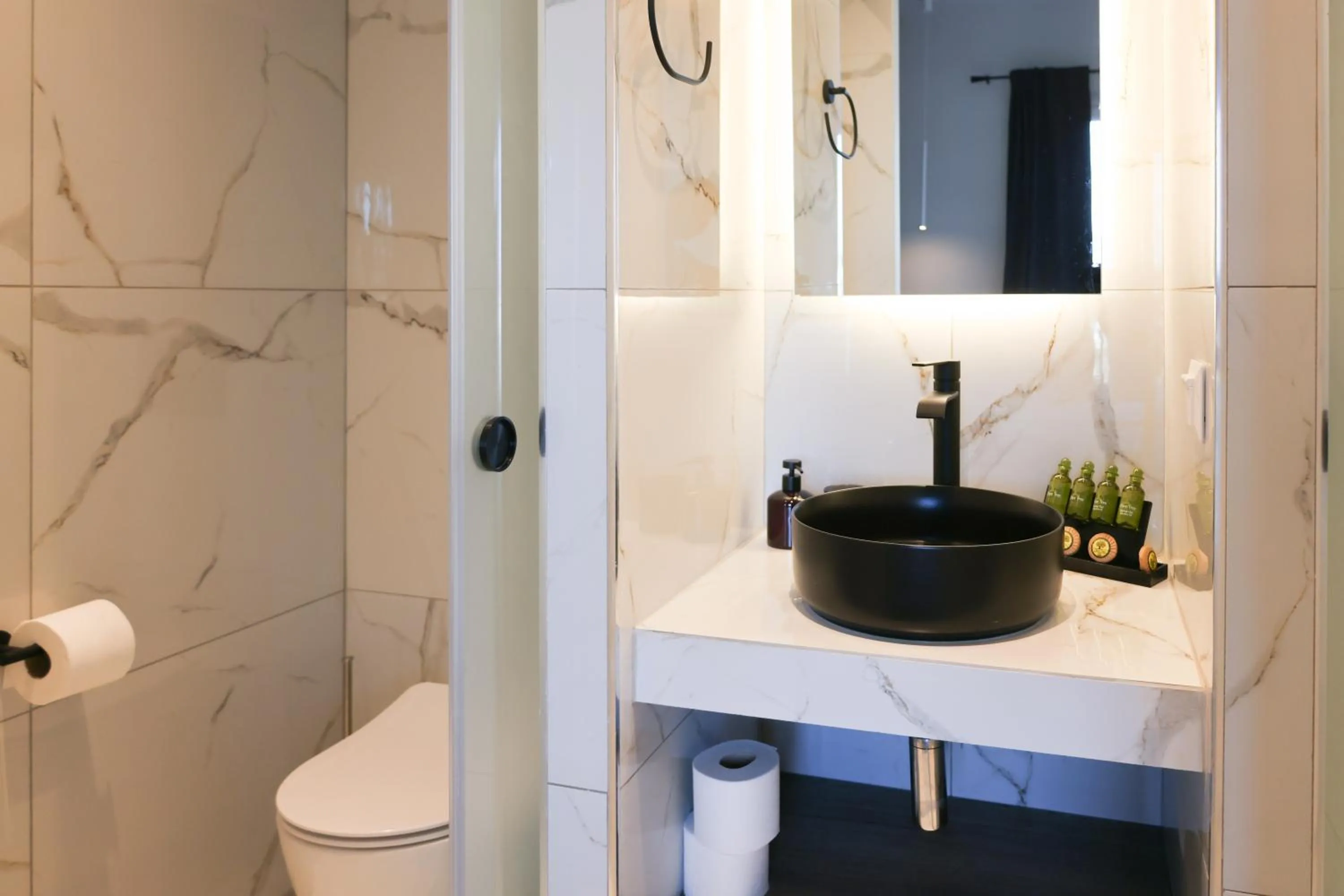 Toilet in Uphill Unique Boutique Suites