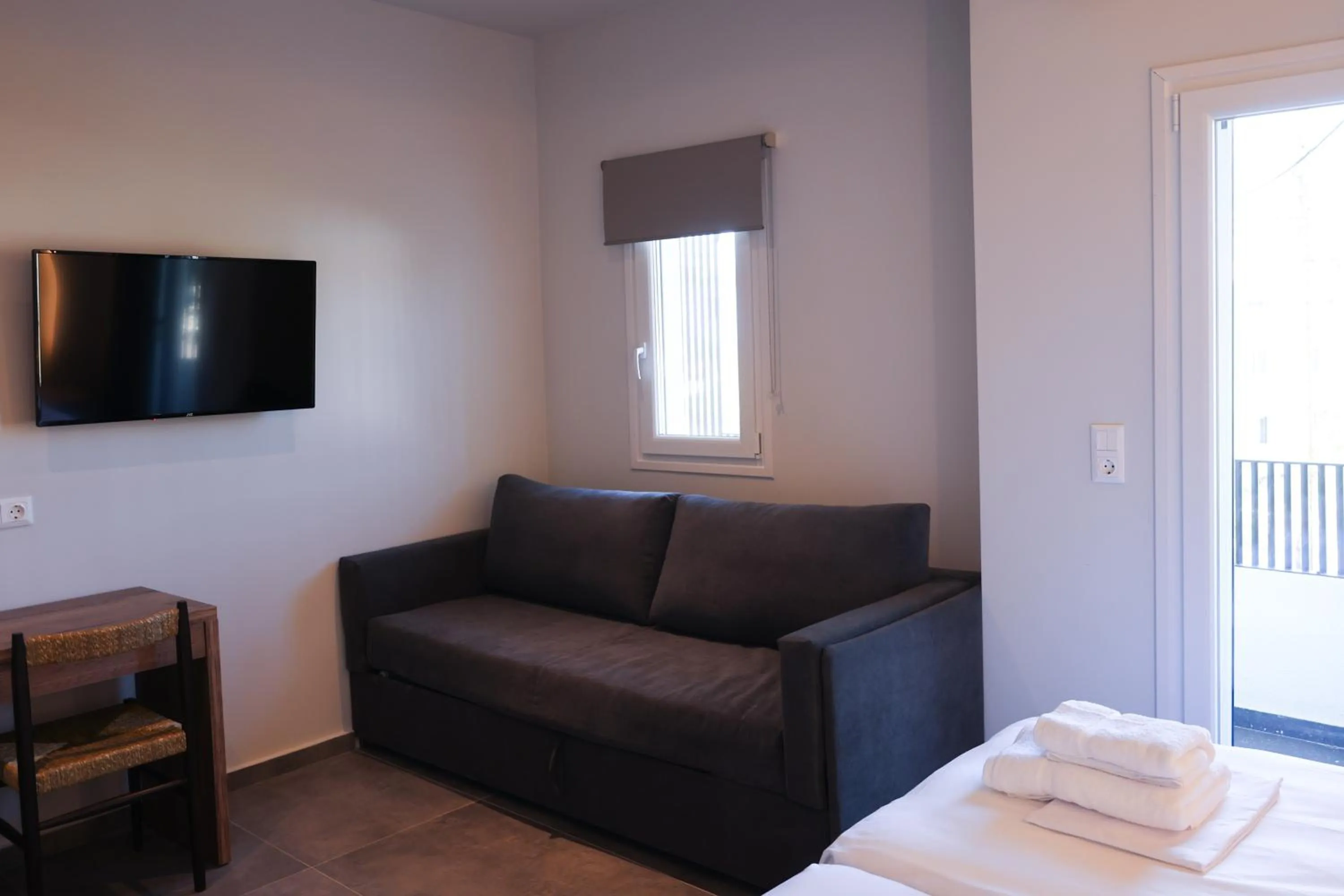 Seating area, Bed in Uphill Unique Boutique Suites