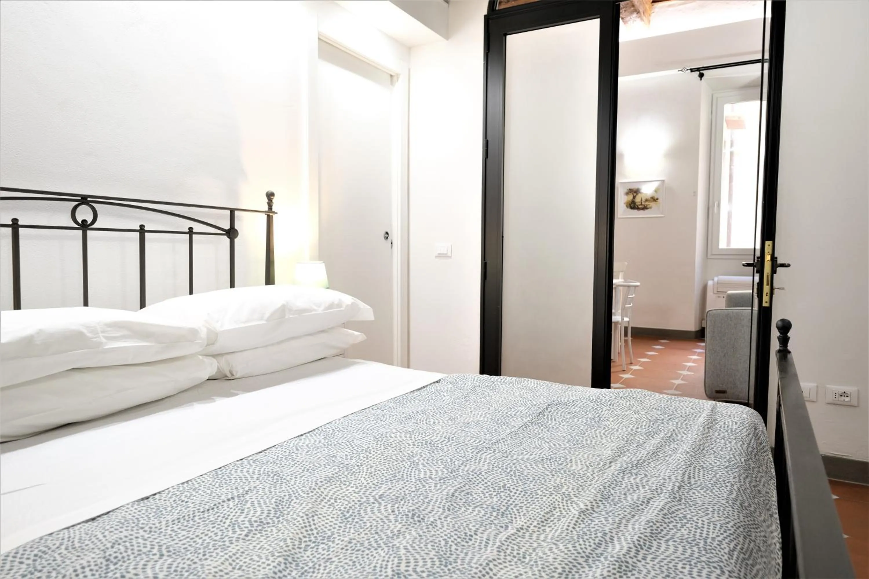 Bed in Wine Apartments Florence Ribolla