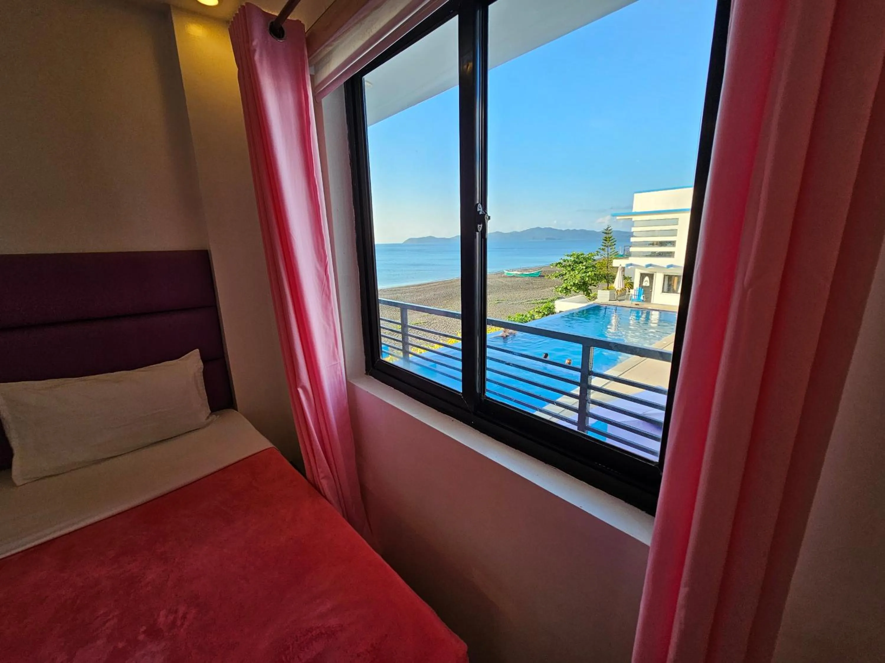 Bed in Blue Coast Beach Hotel