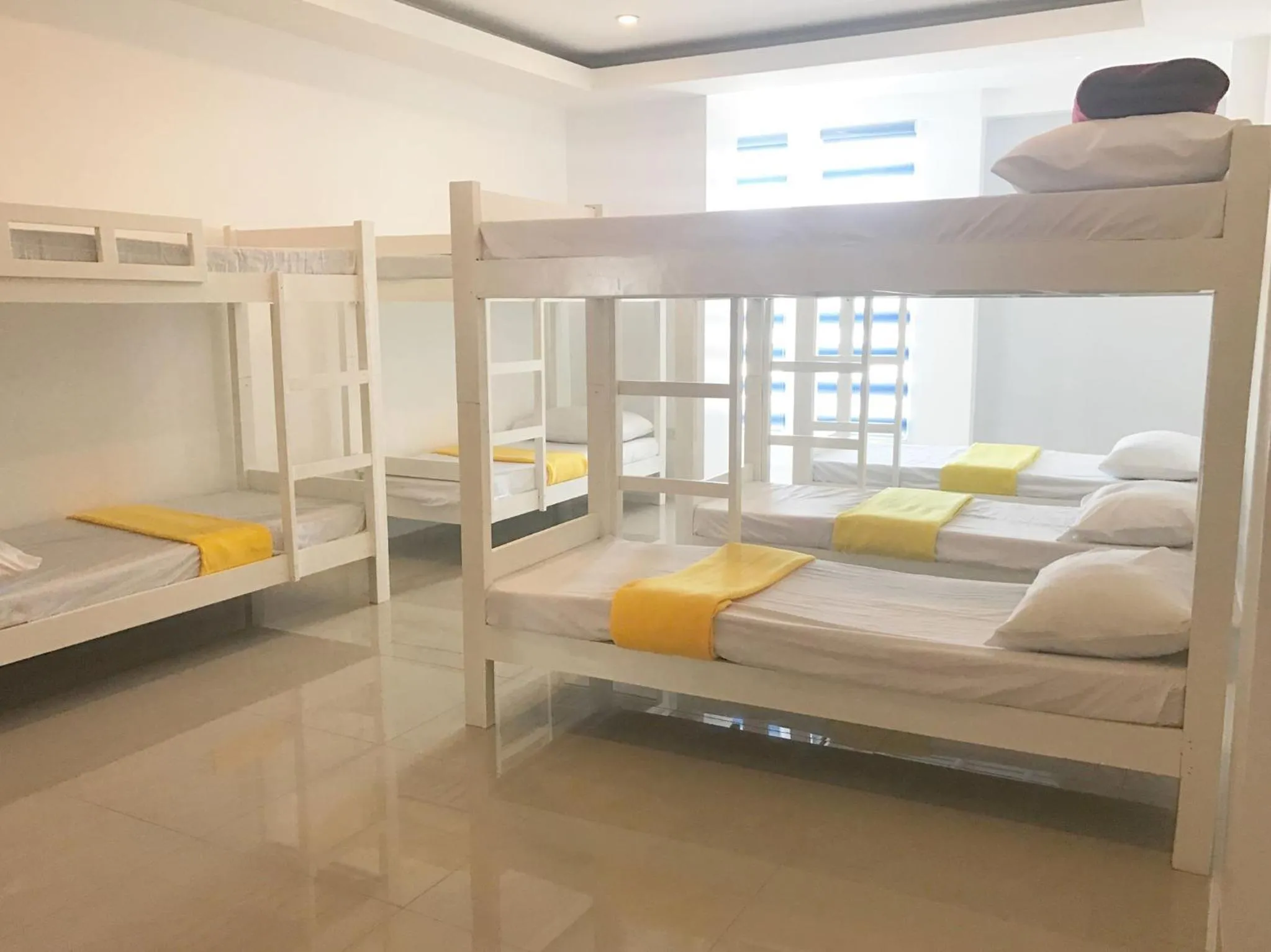 Bed in Blue Coast Beach Hotel