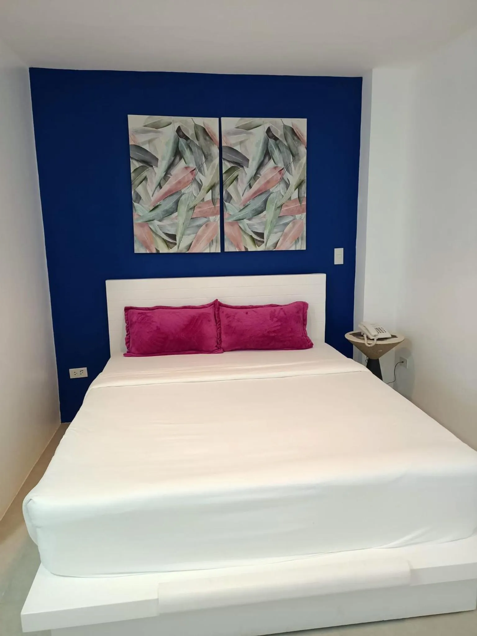 Bed in Blue Coast Beach Hotel