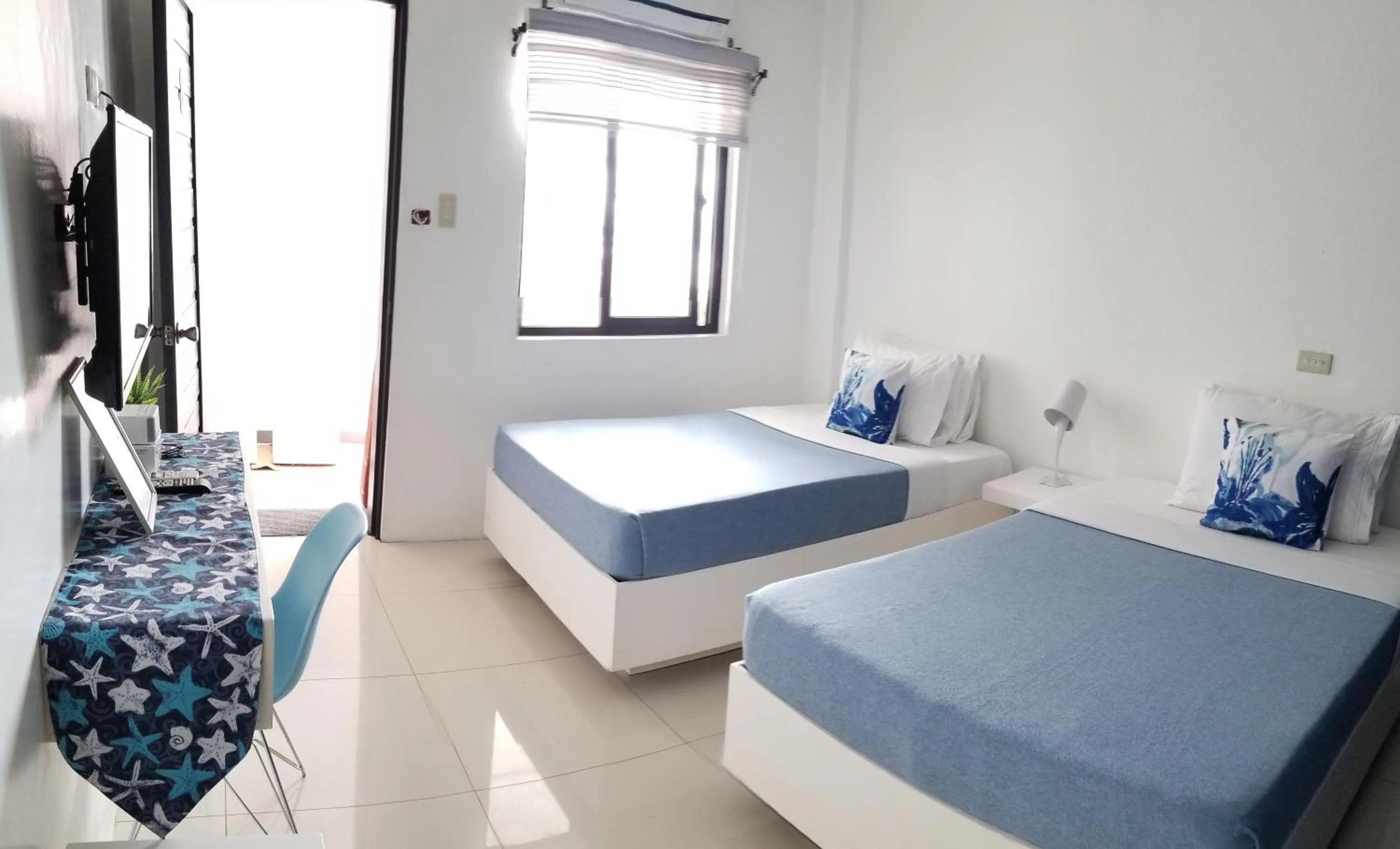 Bed in Blue Coast Beach Hotel