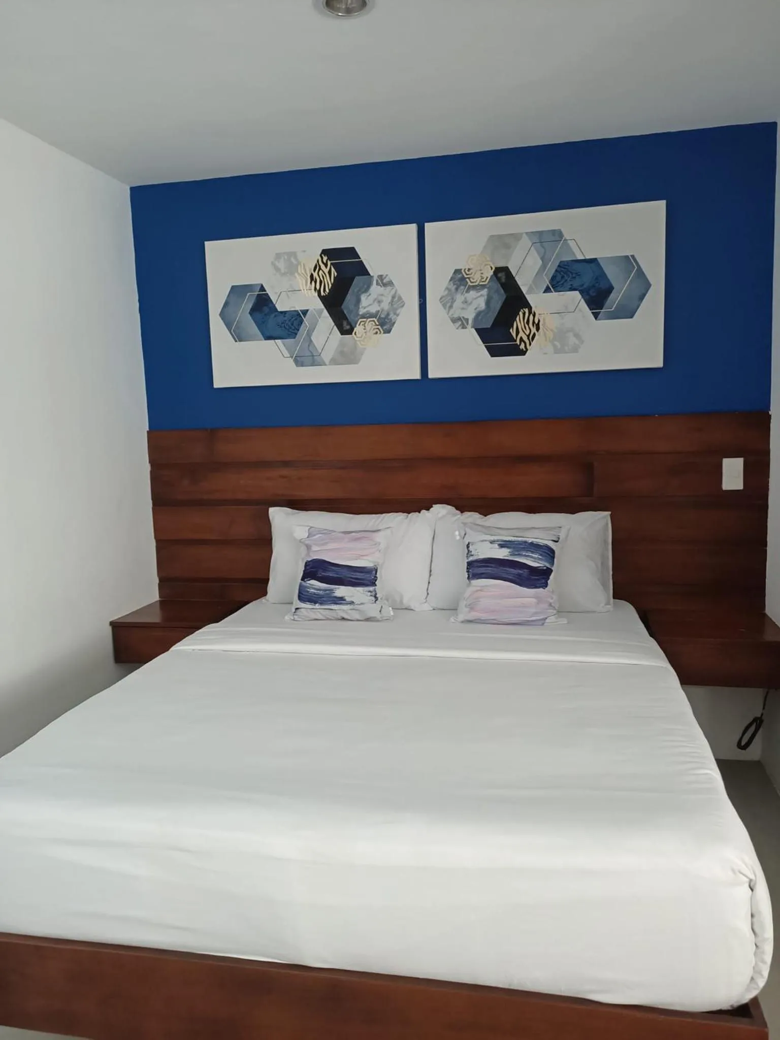 Bed in Blue Coast Beach Hotel