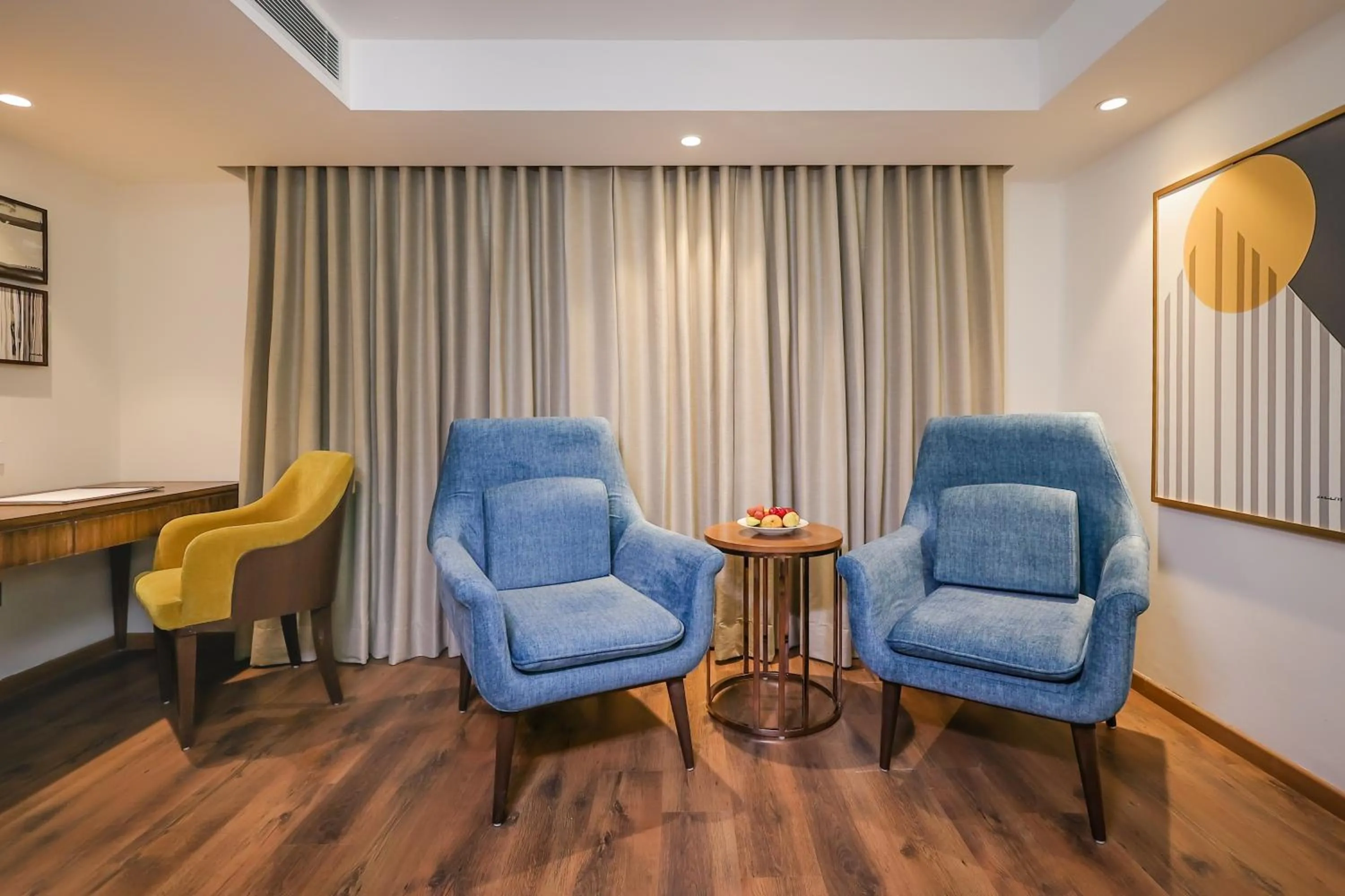 Living room in Regenta Dehradun by Royal Orchid Hotels Limited