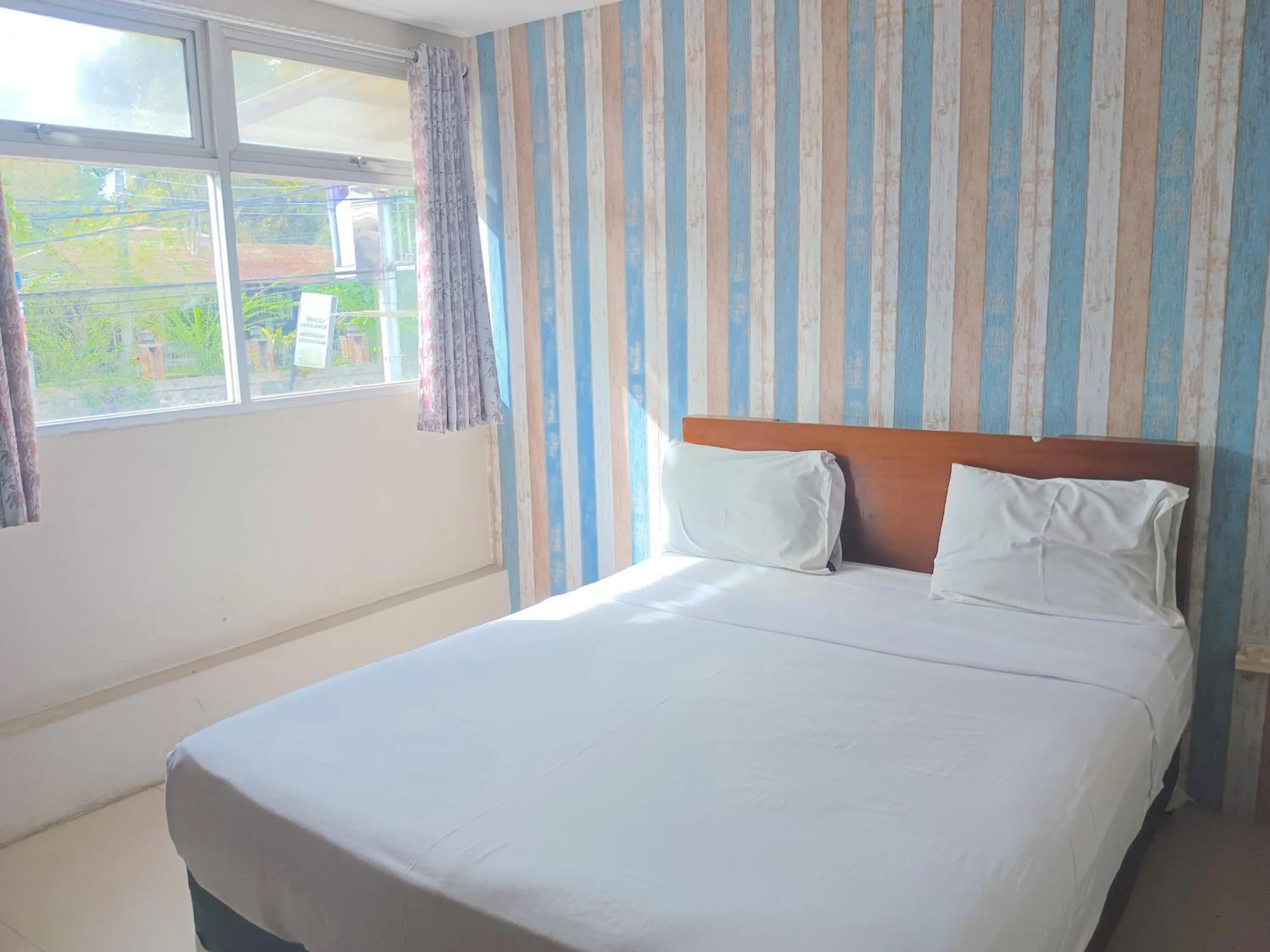 Bed in The Aurora by Makati