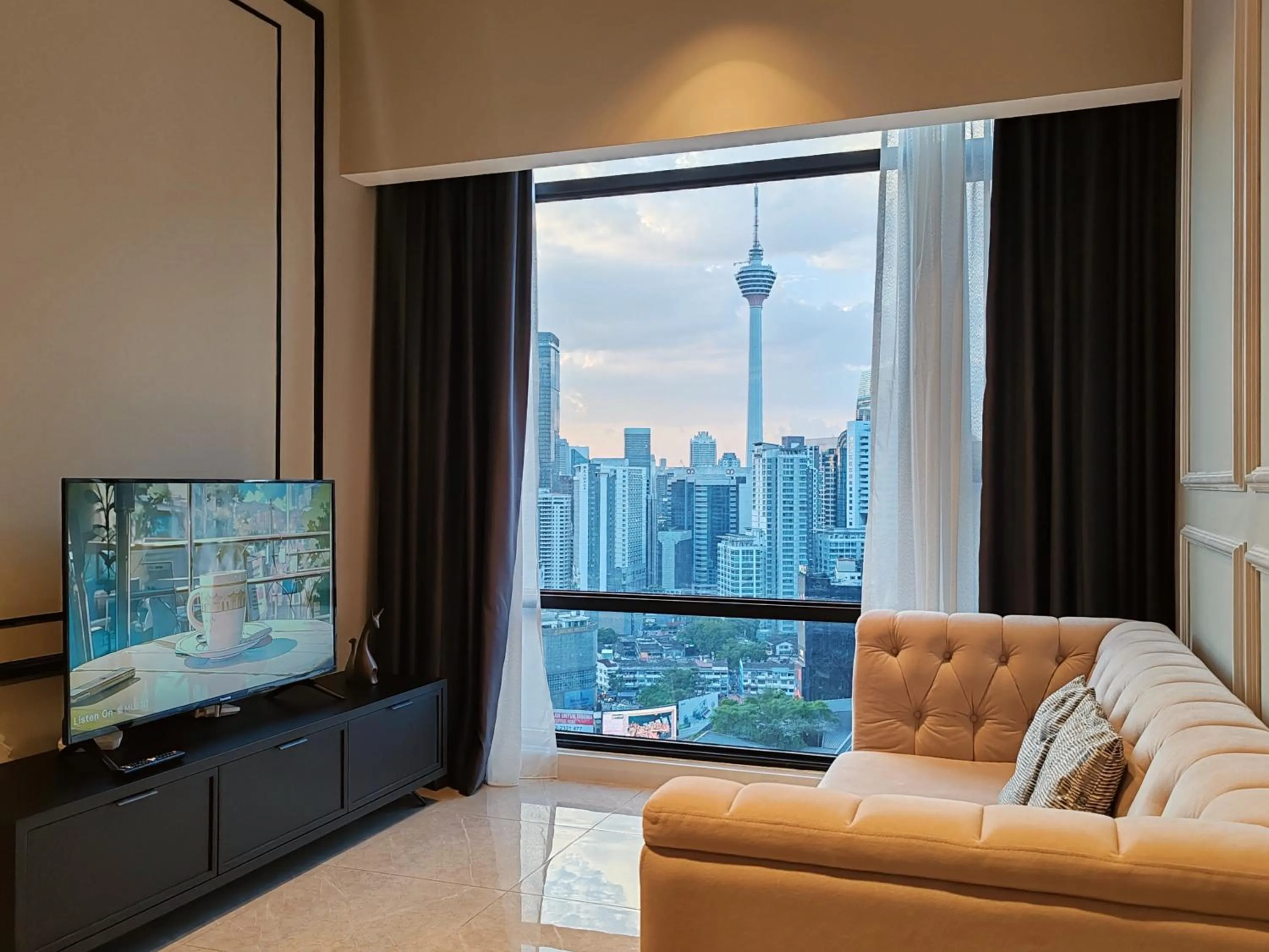 Communal lounge/ TV room in The Axon Bukit Bintang by SMOVF BNB