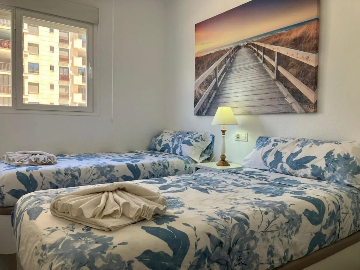 Bed in Seaside Apartment Retreat