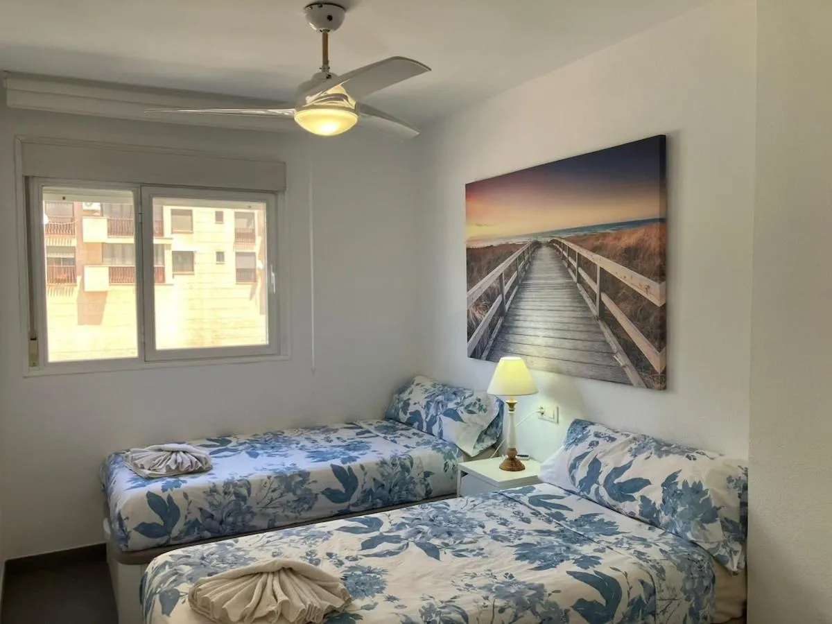 Bed in Seaside Apartment Retreat
