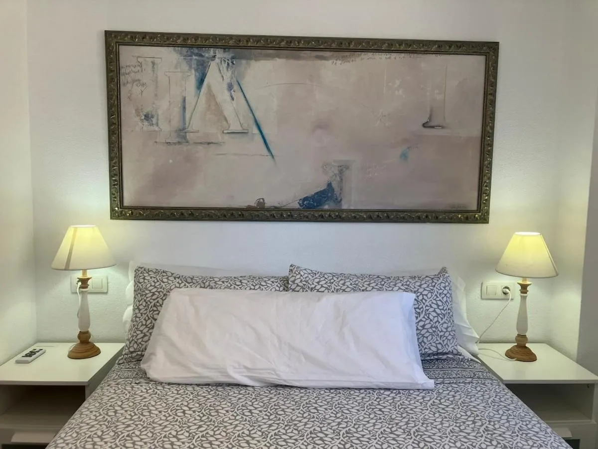 Bed in Seaside Apartment Retreat