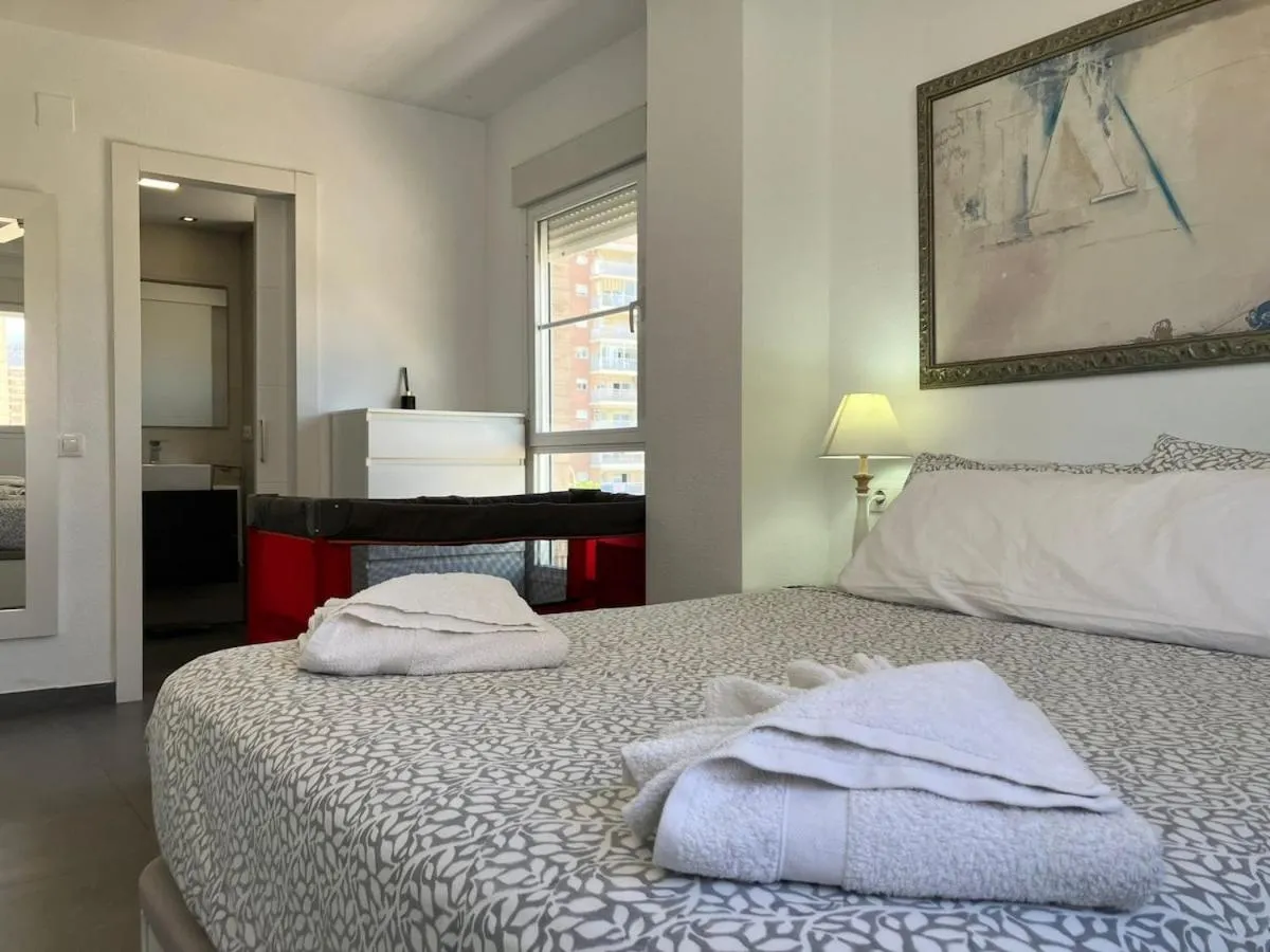 Bed in Seaside Apartment Retreat