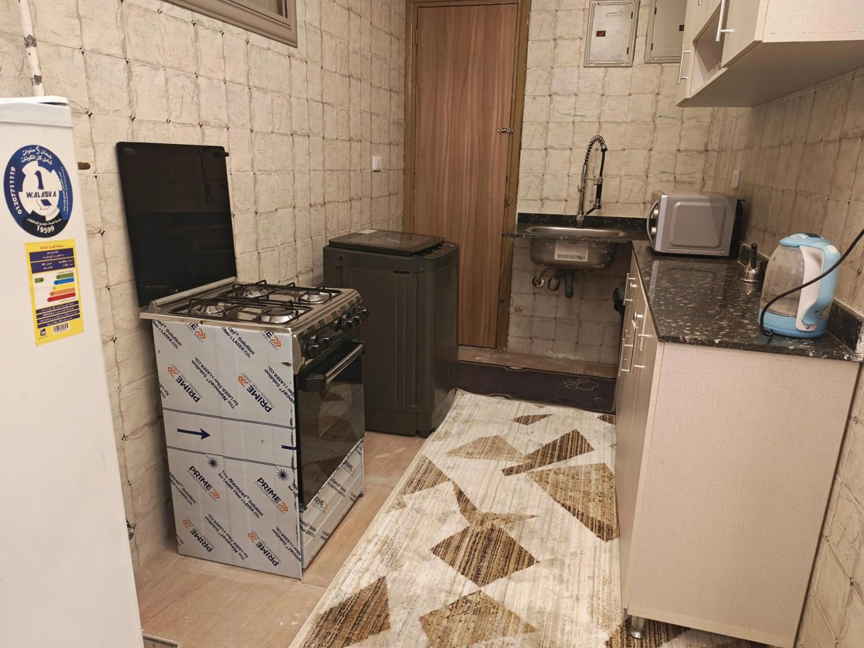 Kitchen or kitchenette in downtown Family Suites