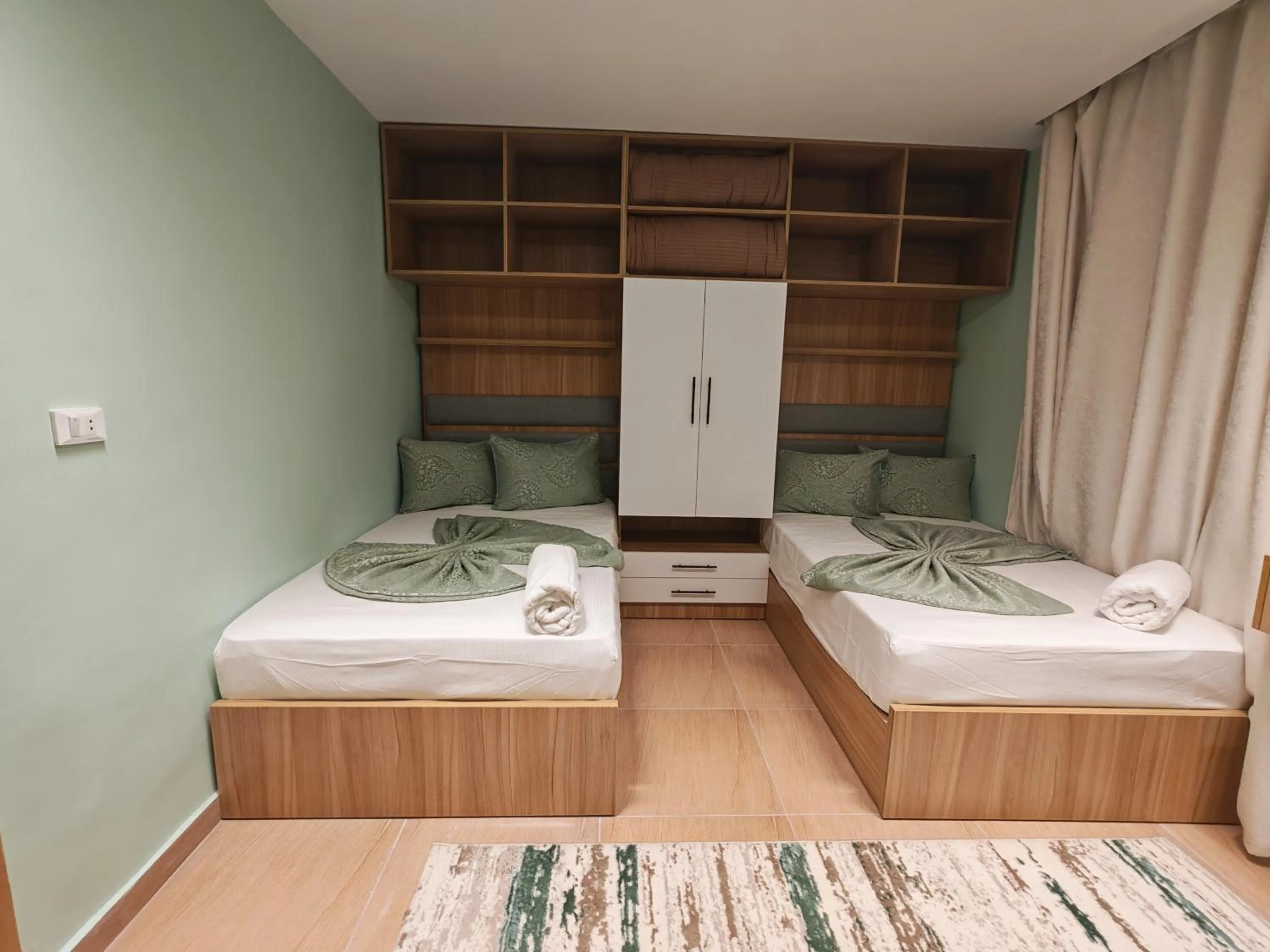 Photo of the whole room, Bed in downtown Family Suites