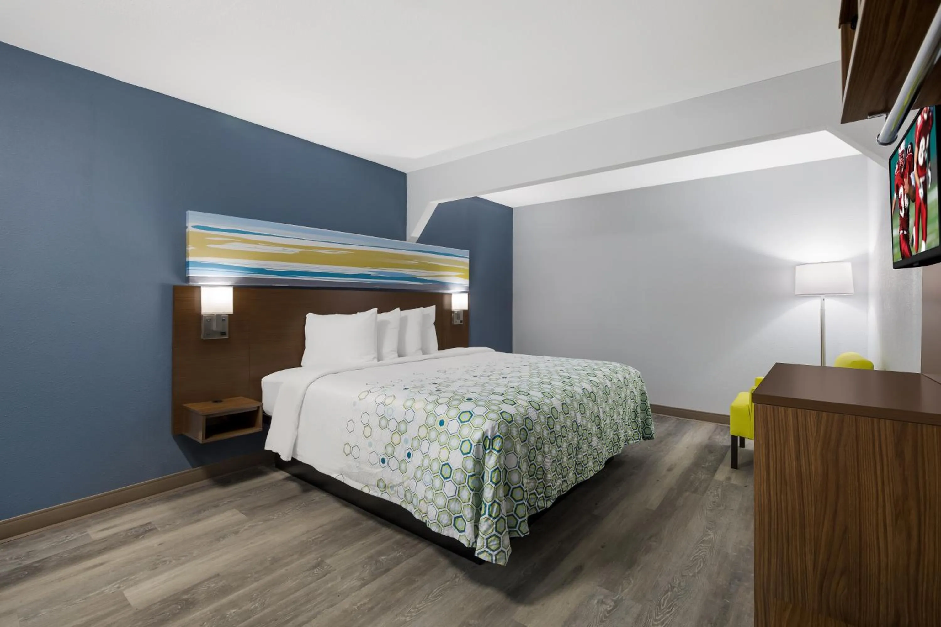 Bed in HomeTowne Studios by Red Roof Orange, TX