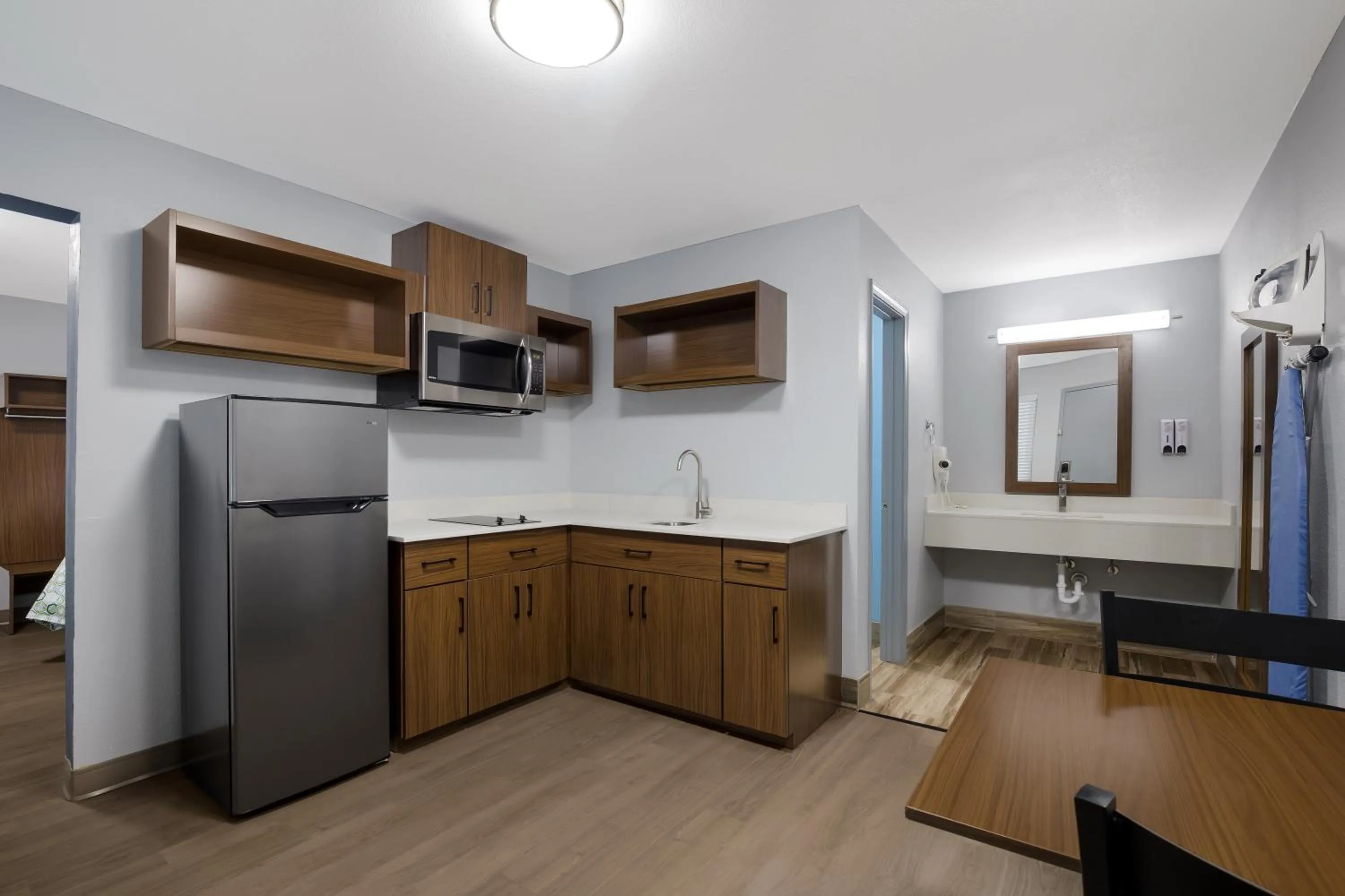 Kitchen or kitchenette in HomeTowne Studios by Red Roof Orange, TX