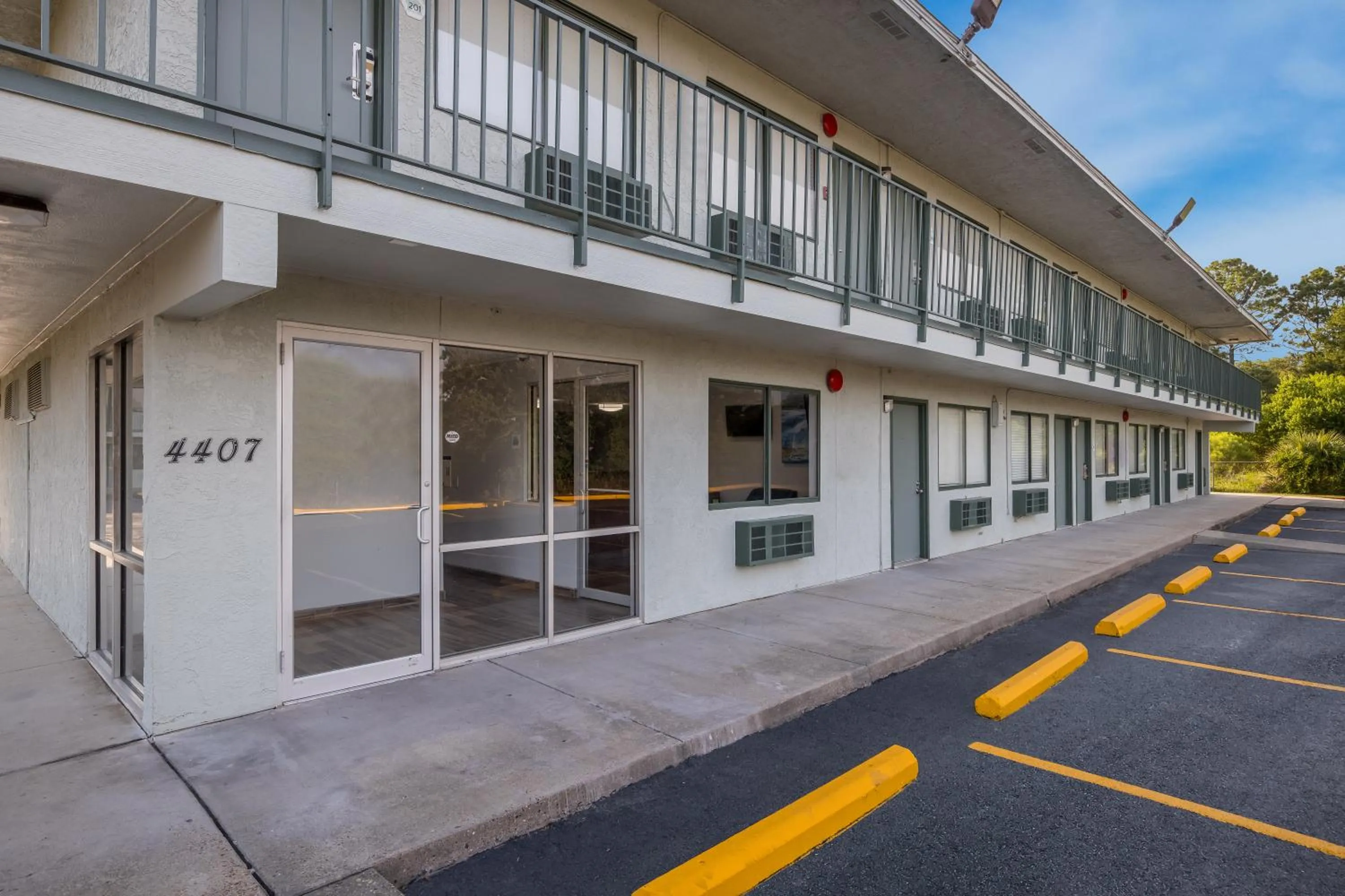 Property building in HomeTowne Studios by Red Roof Orange, TX