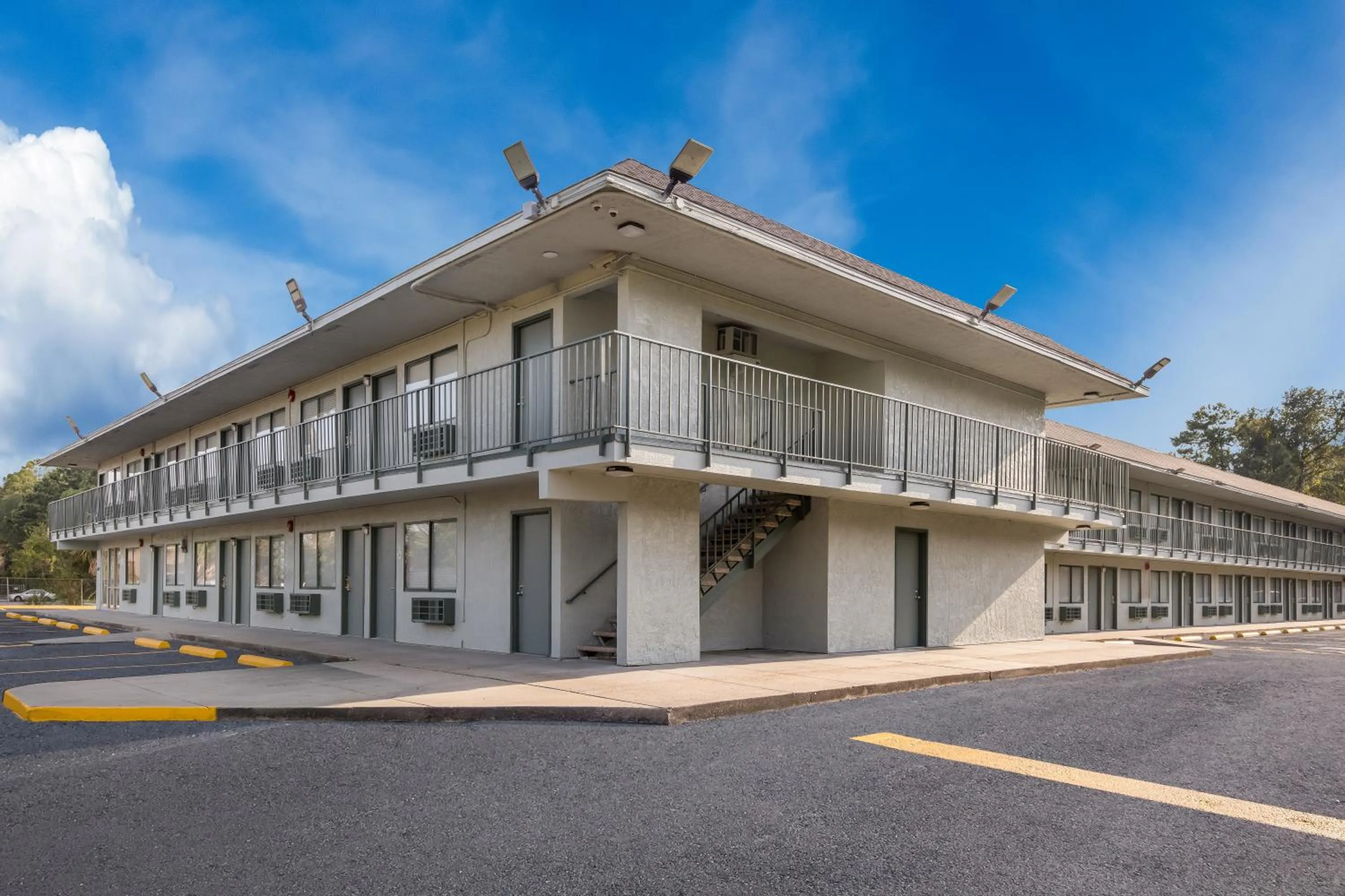 Property building in HomeTowne Studios by Red Roof Orange, TX