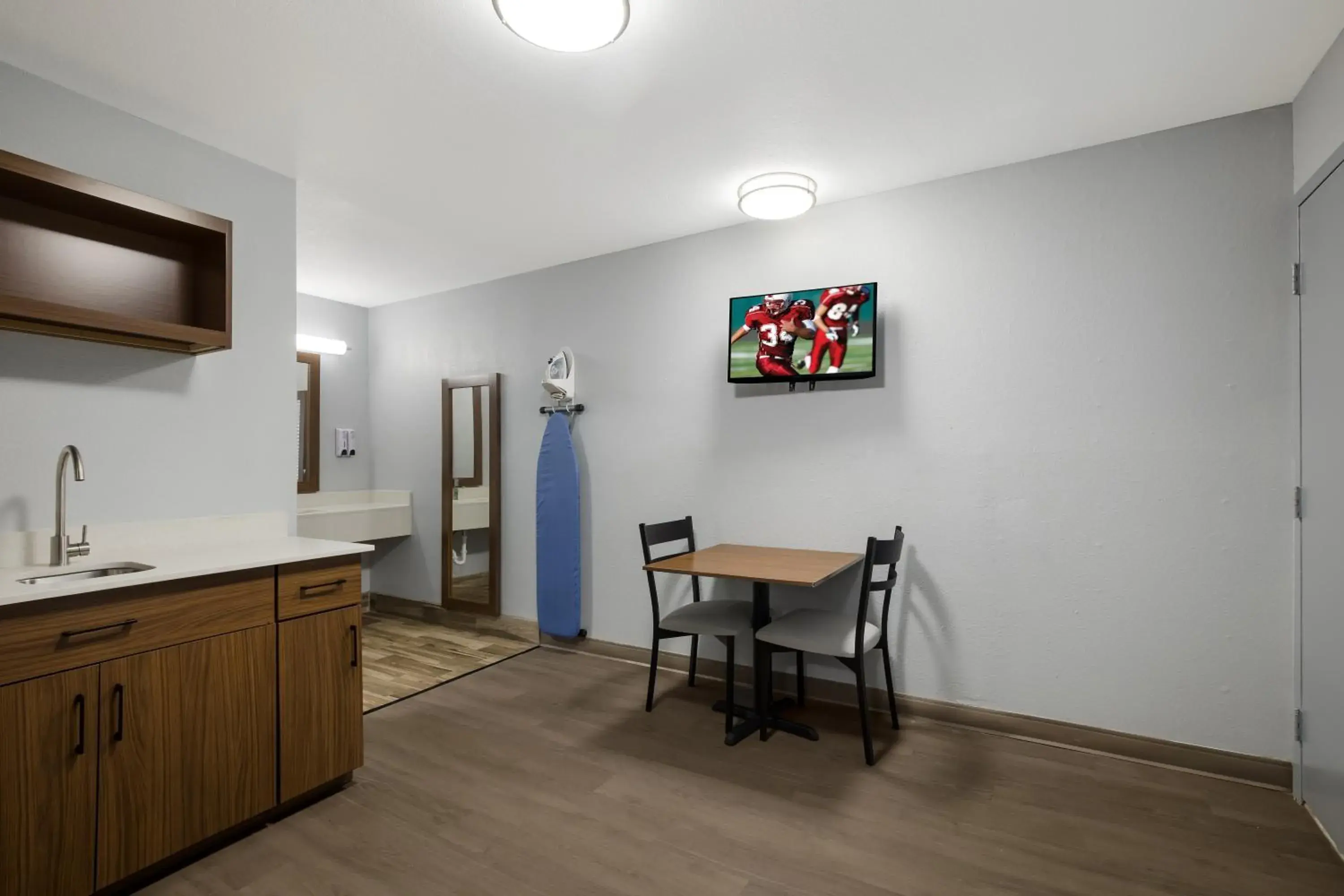 Bedroom in HomeTowne Studios by Red Roof Orange, TX Bedroom in HomeTowne Studios by Red Roof Orange, TX