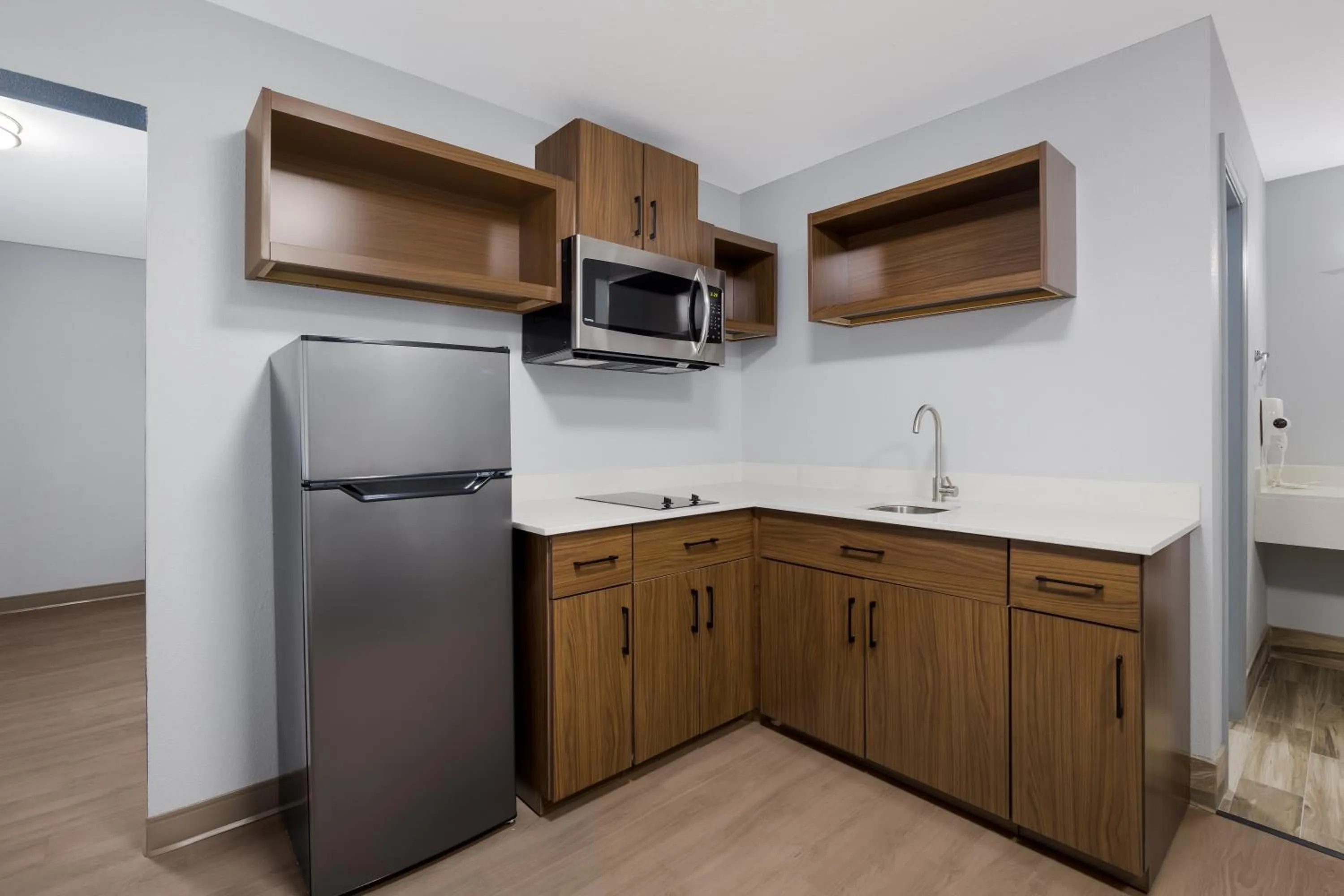 Kitchen or kitchenette in HomeTowne Studios by Red Roof Orange, TX