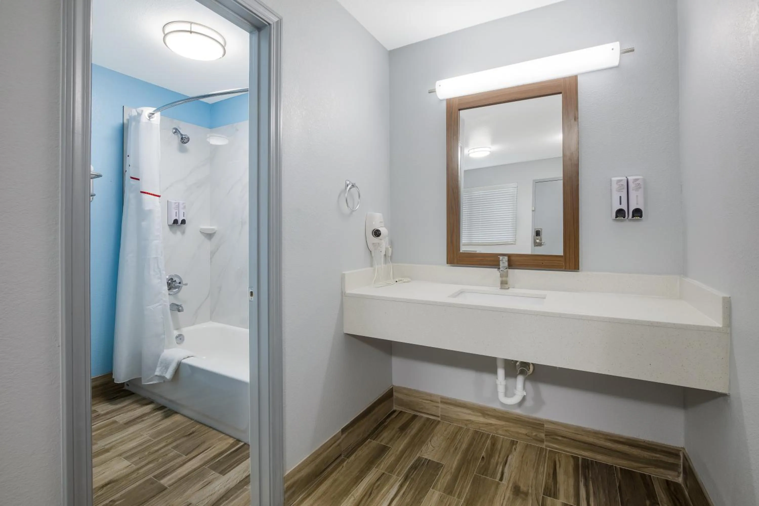 Bathroom in HomeTowne Studios by Red Roof Orange, TX