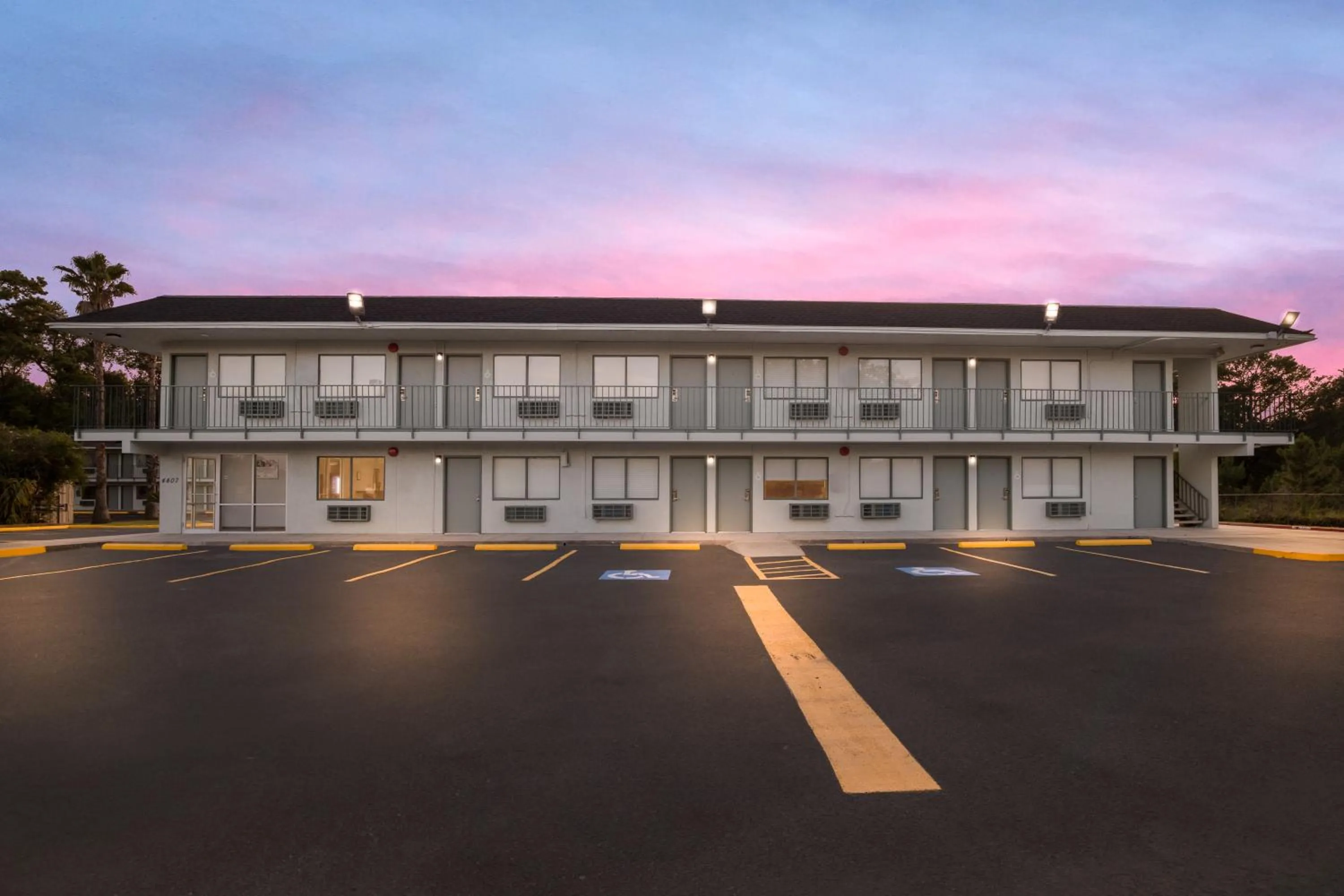 Property building in HomeTowne Studios by Red Roof Orange, TX