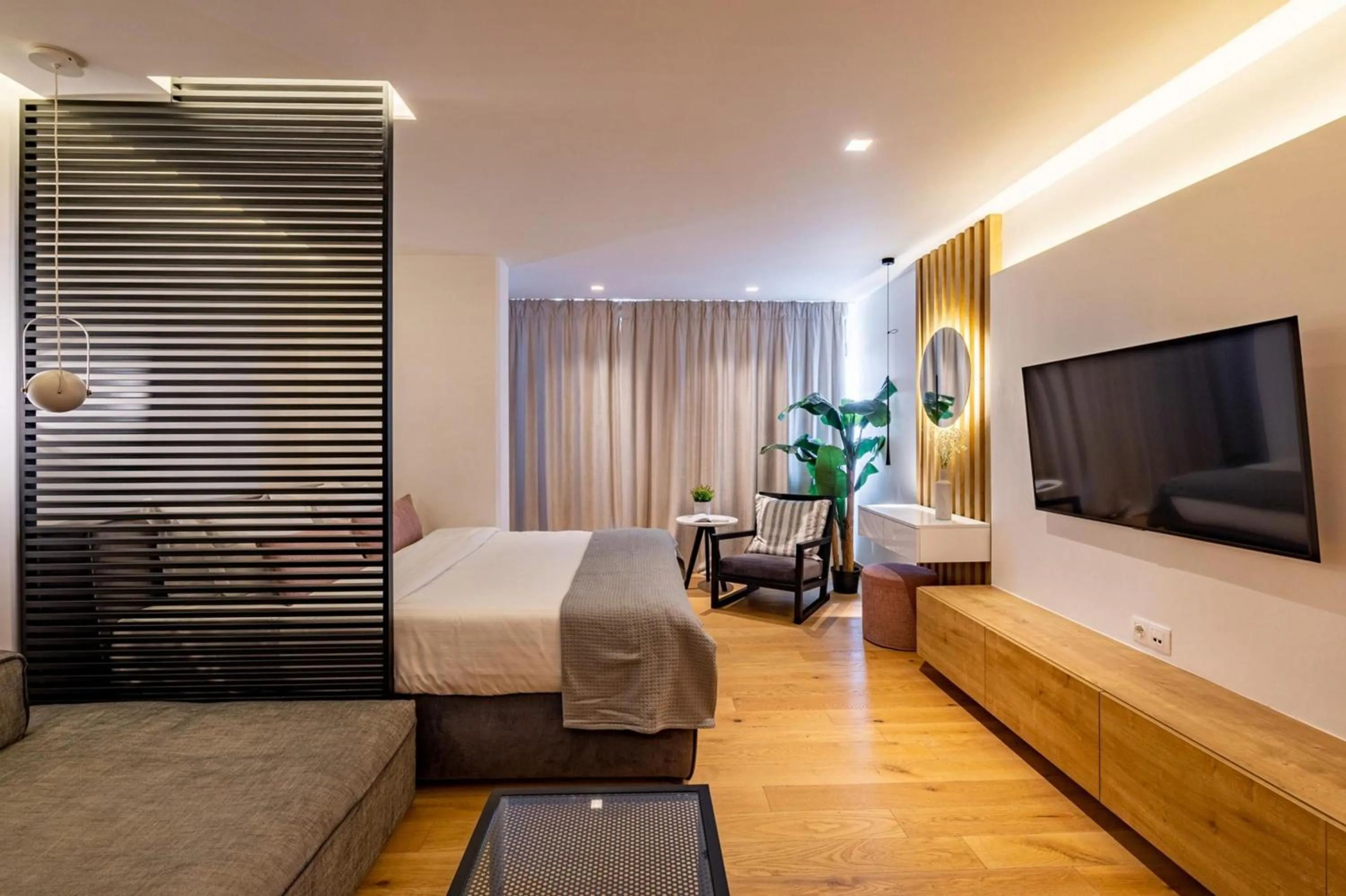 Bed in Earth Boutique Apartments next to Stavros Niarchos