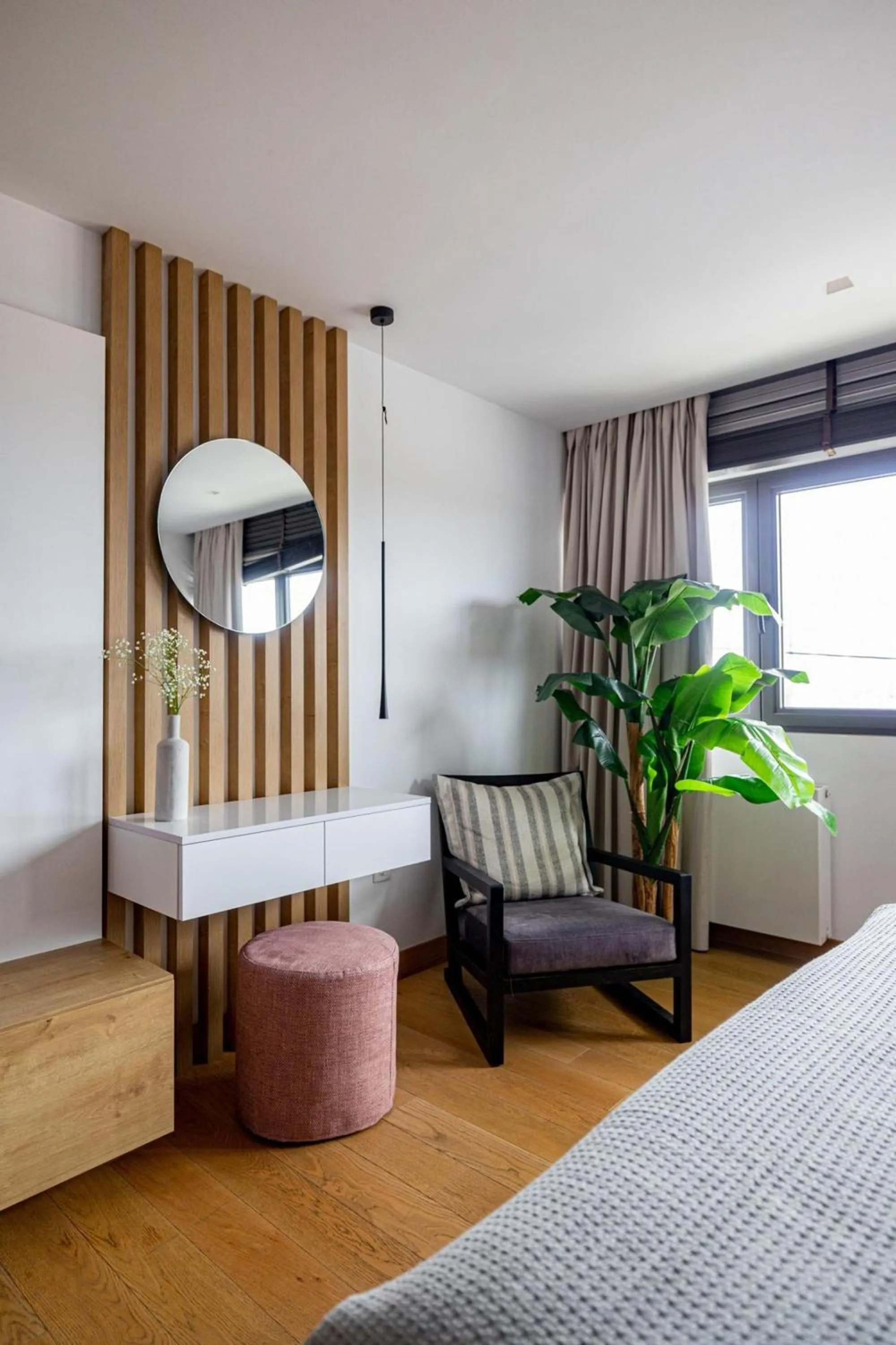 Bed in Earth Boutique Apartments next to Stavros Niarchos