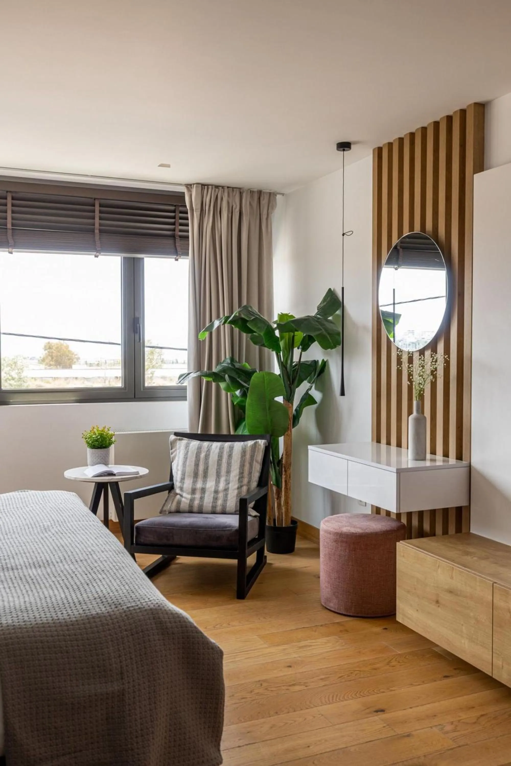 Bed in Earth Boutique Apartments next to Stavros Niarchos