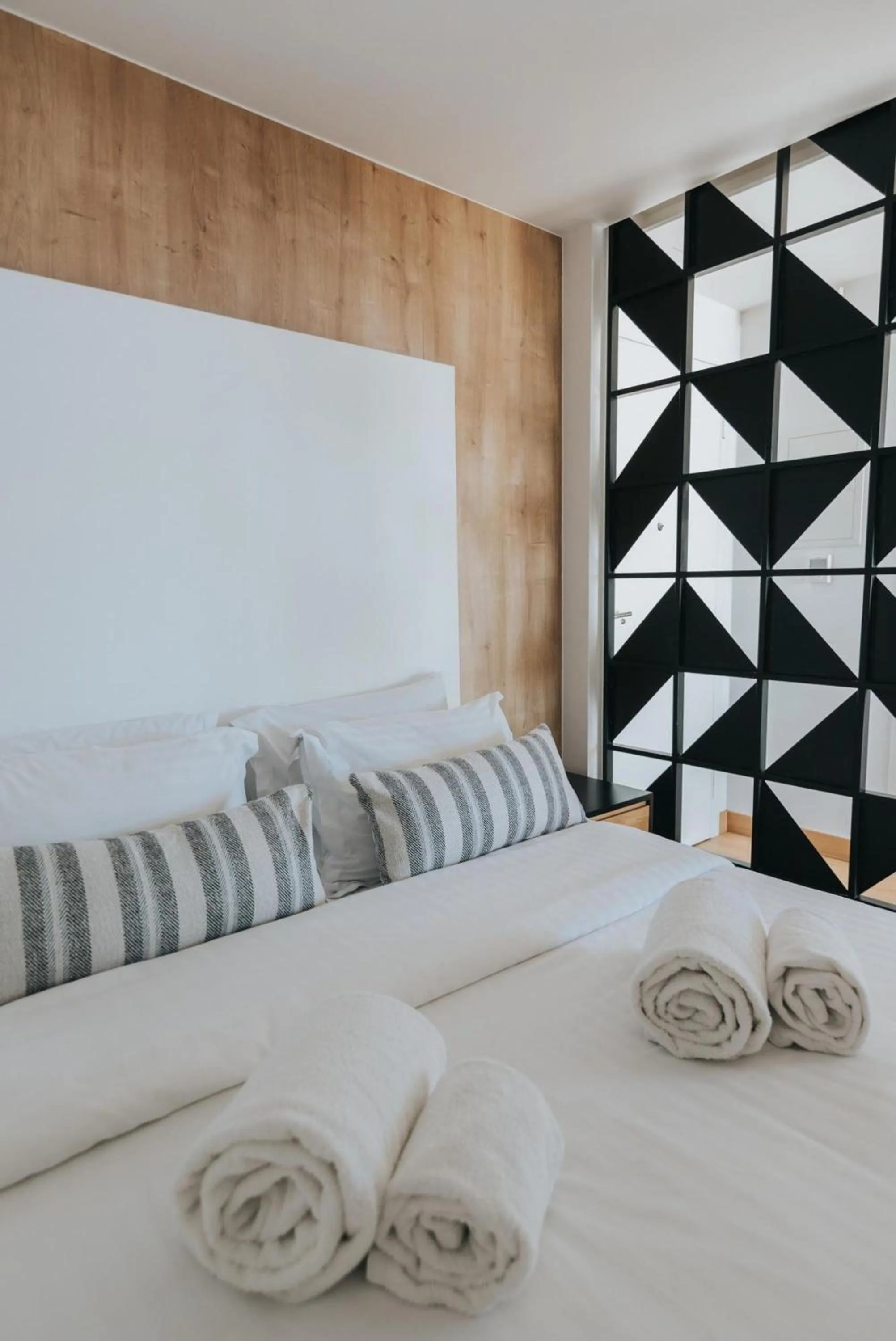 Bed in Earth Boutique Apartments next to Stavros Niarchos