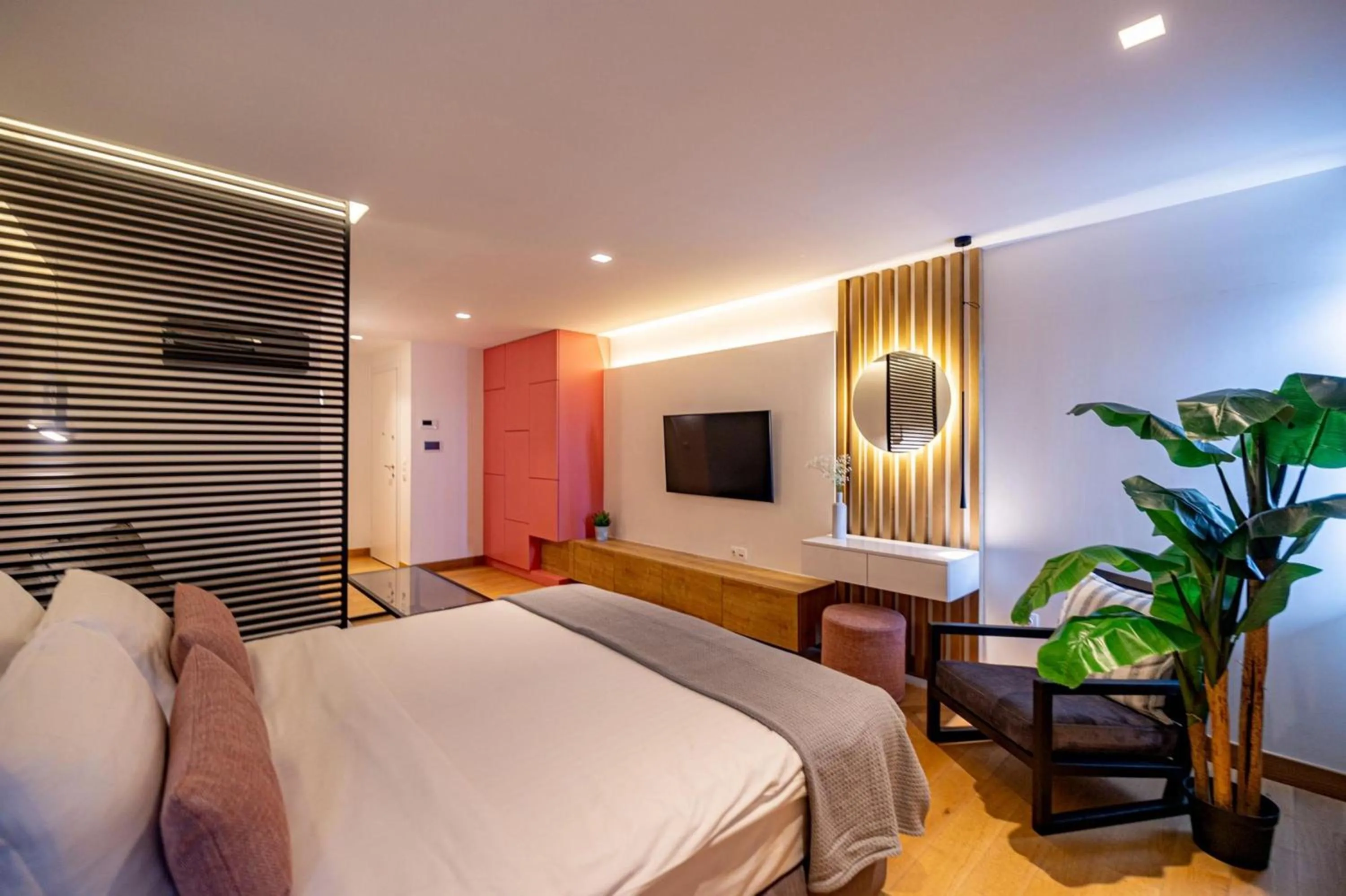 Bed in Earth Boutique Apartments next to Stavros Niarchos