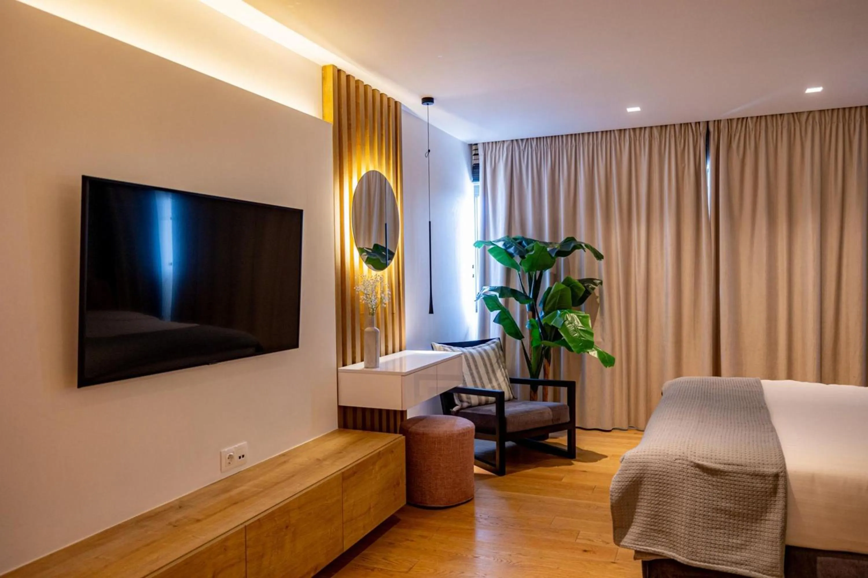 Bed in Earth Boutique Apartments next to Stavros Niarchos