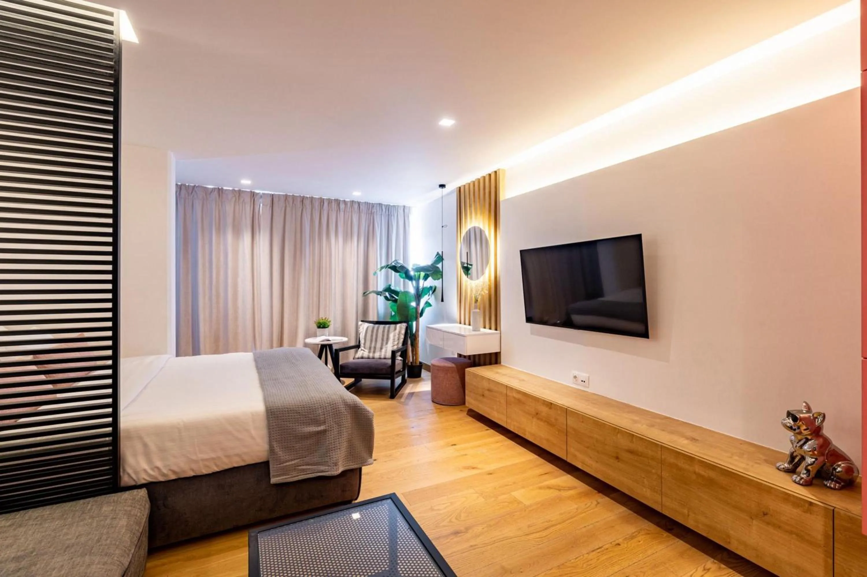 Bed in Earth Boutique Apartments next to Stavros Niarchos